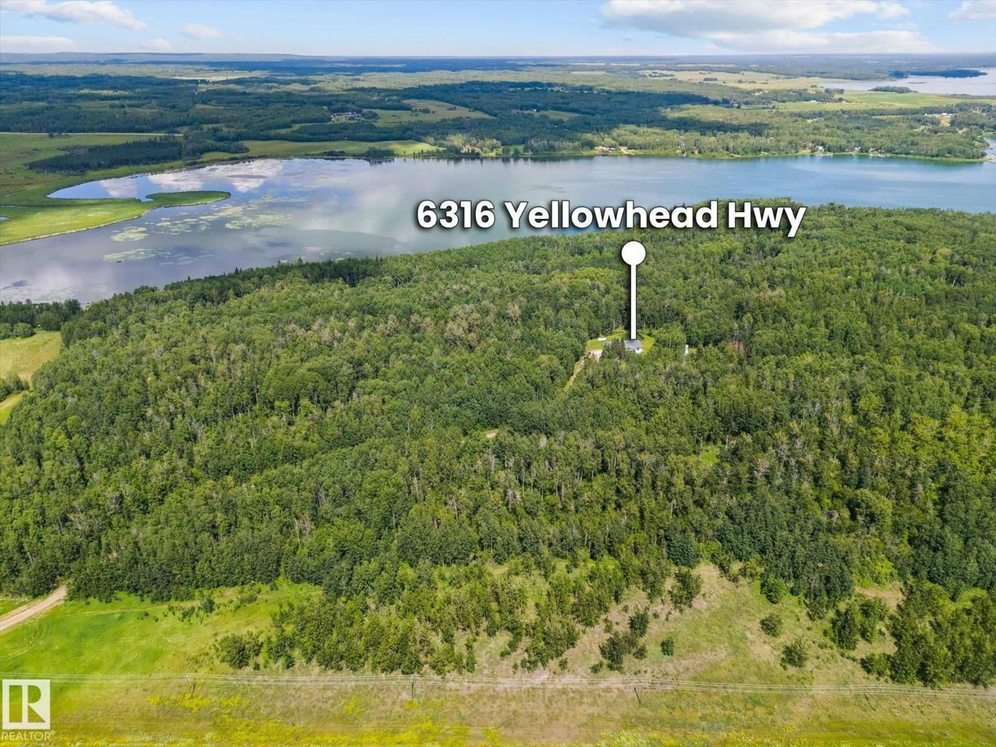 A pic from outside/outdoor area/front of a property/back of a property/a pic from drone, water/lake/river/ocean view for 6316 HGHWAY 16, Rural Parkland County Alberta T0E0W0