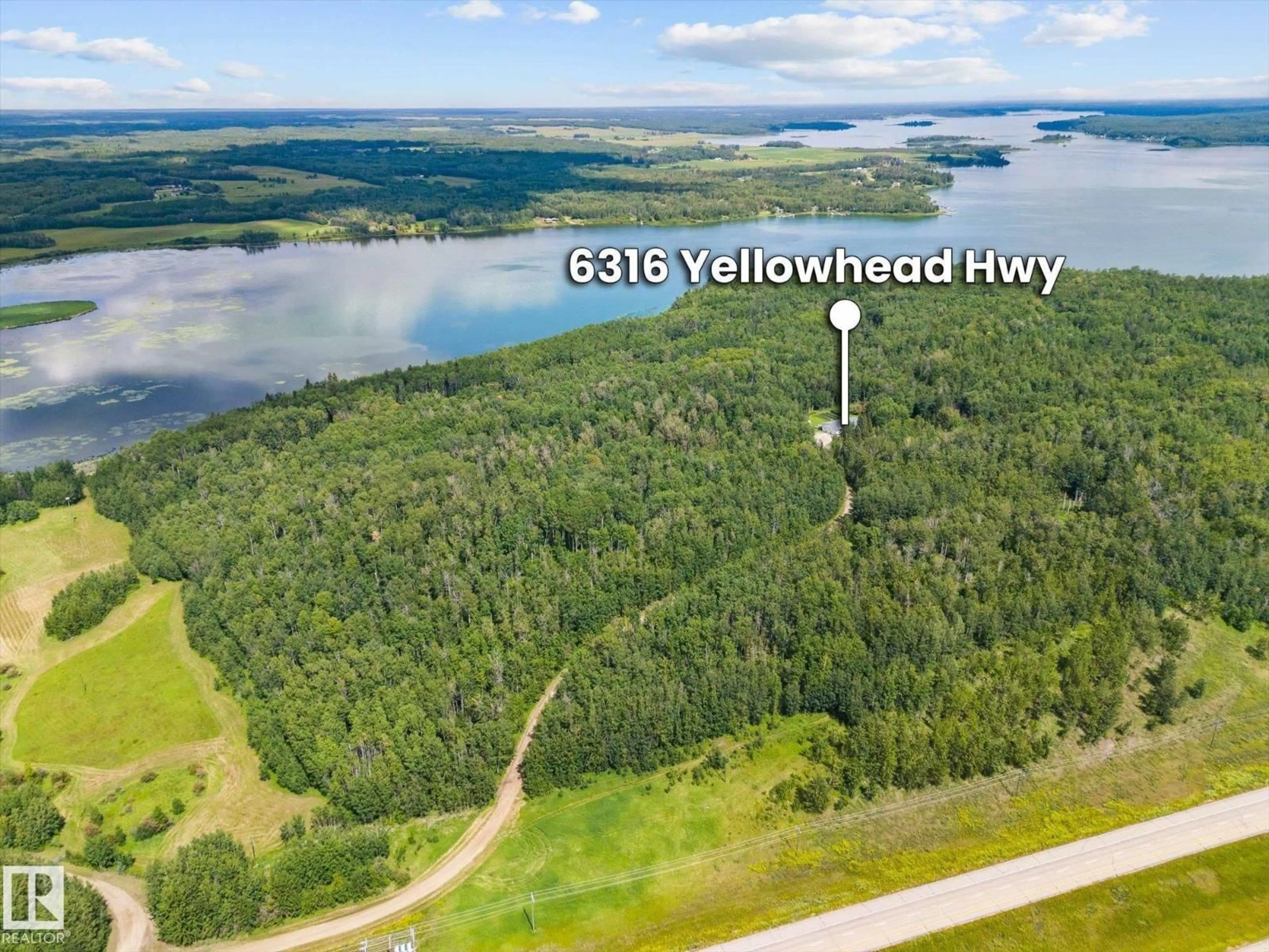 A pic from outside/outdoor area/front of a property/back of a property/a pic from drone, water/lake/river/ocean view for 6316 HGHWAY 16, Rural Parkland County Alberta T0E0W0
