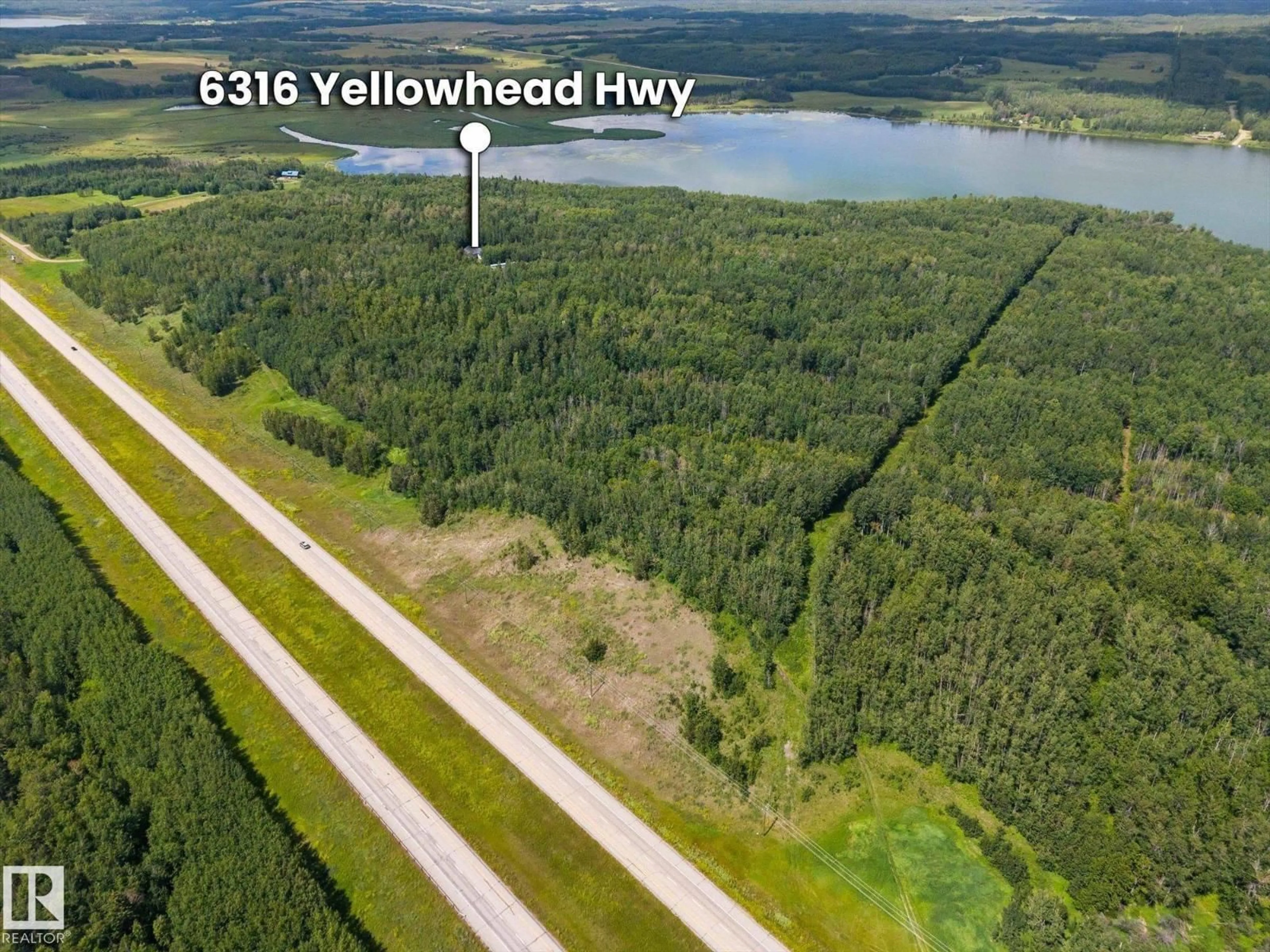 A pic from outside/outdoor area/front of a property/back of a property/a pic from drone, water/lake/river/ocean view for 6316 HGHWAY 16, Rural Parkland County Alberta T0E0W0