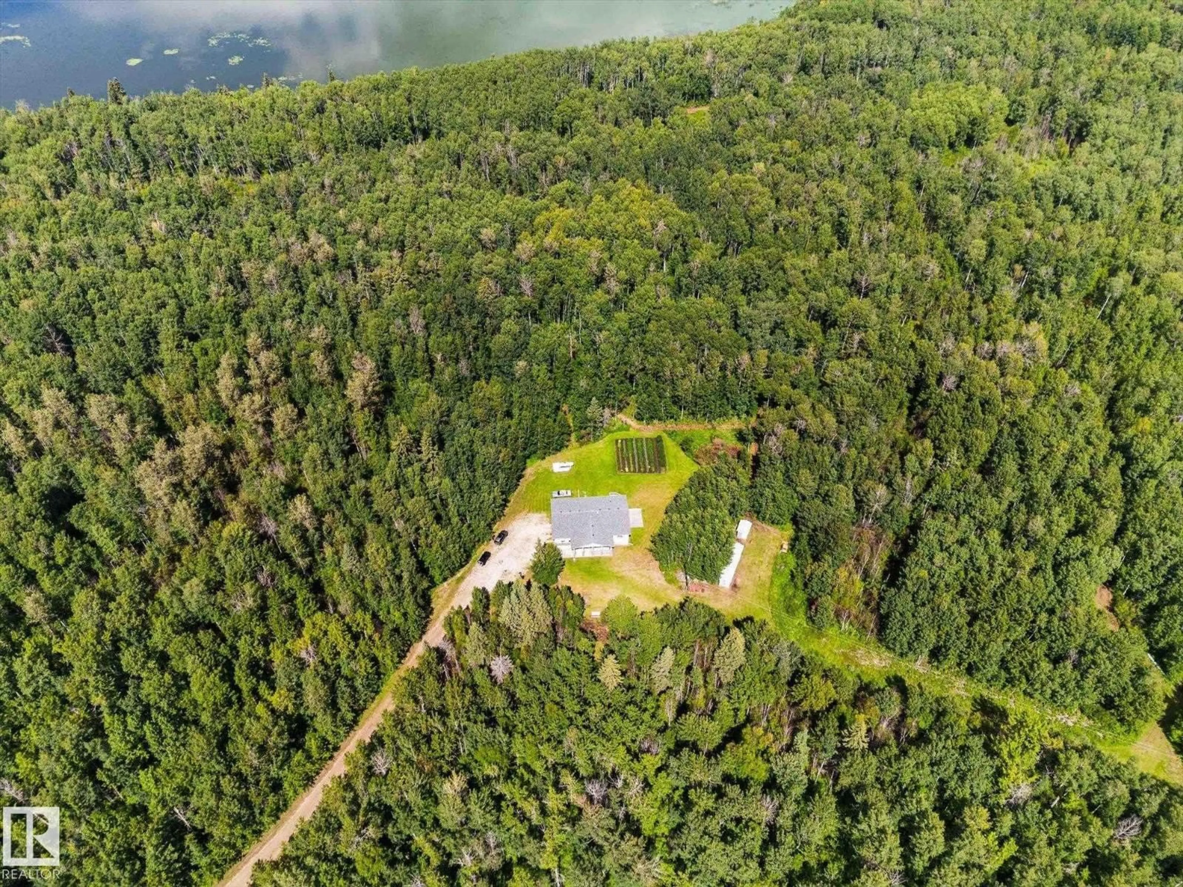 A pic from outside/outdoor area/front of a property/back of a property/a pic from drone, water/lake/river/ocean view for 6316 HGHWAY 16, Rural Parkland County Alberta T0E0W0