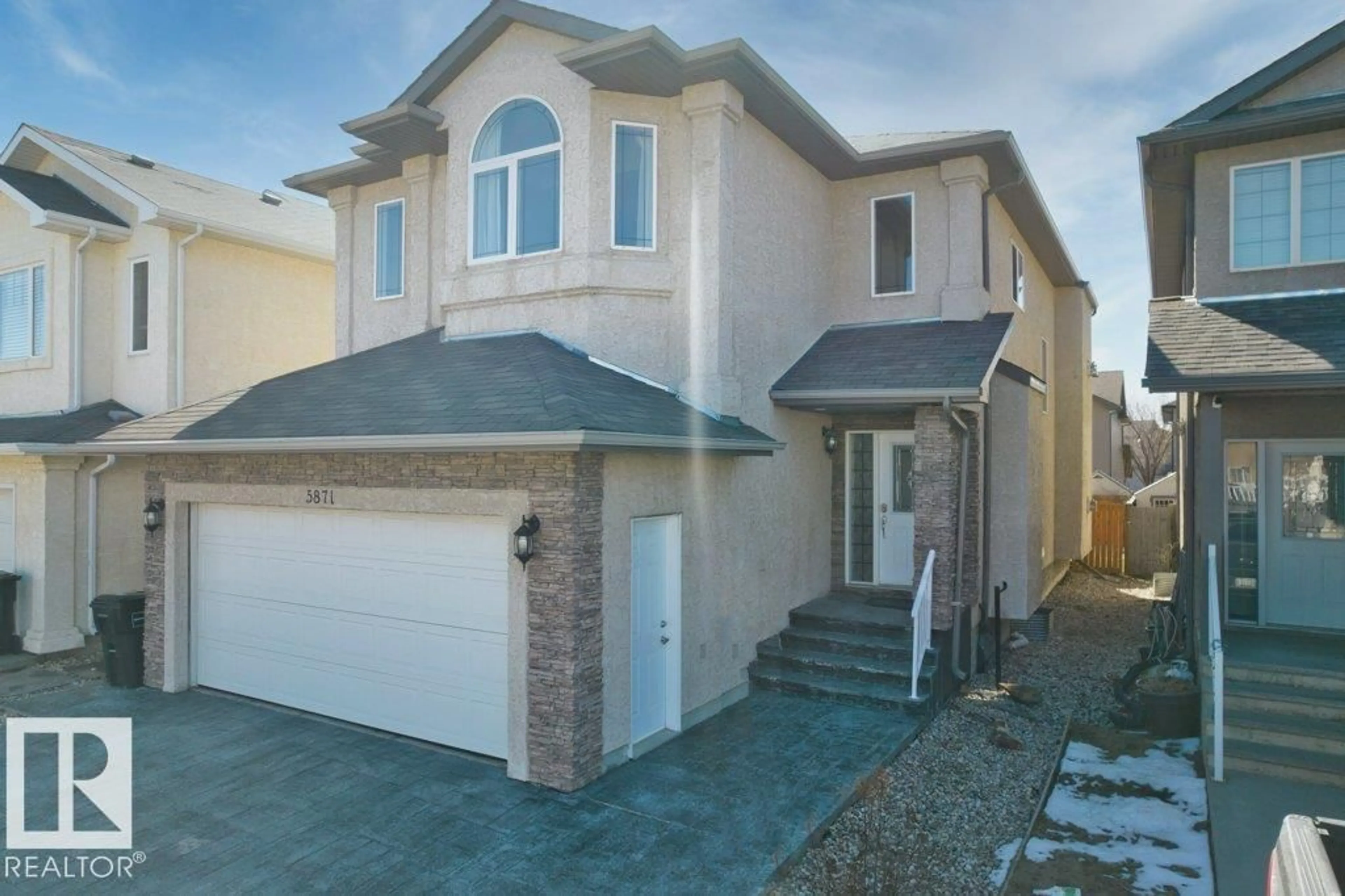 Home with vinyl exterior material, street for NW - 5871 166 AV, Edmonton Alberta T5Y0J2