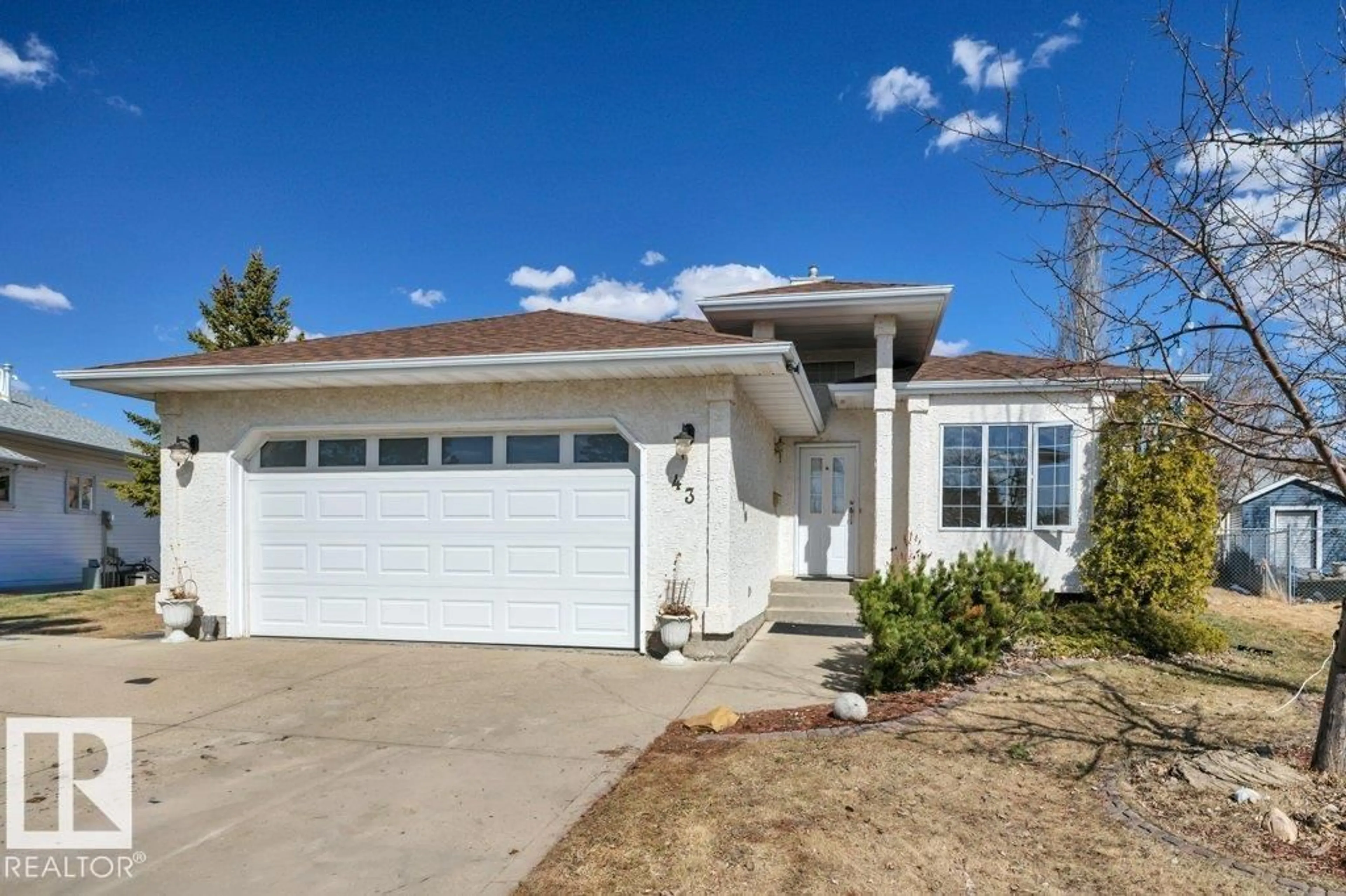 Home with vinyl exterior material, street for 43 MCLEOD CR, Leduc Alberta T9E6N9