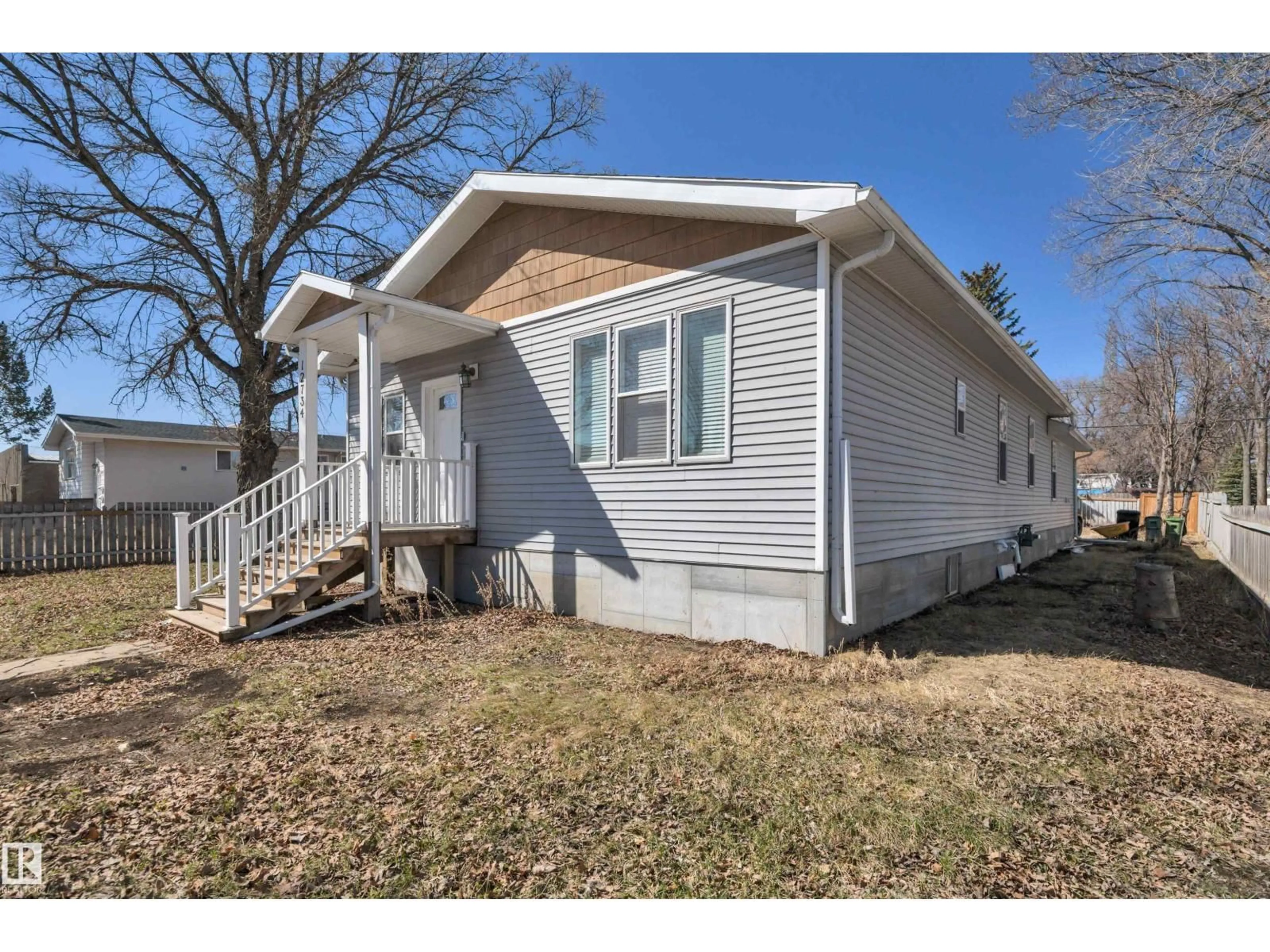 Home with vinyl exterior material, street for NW - 12734 124 ST, Edmonton Alberta T5L0P1
