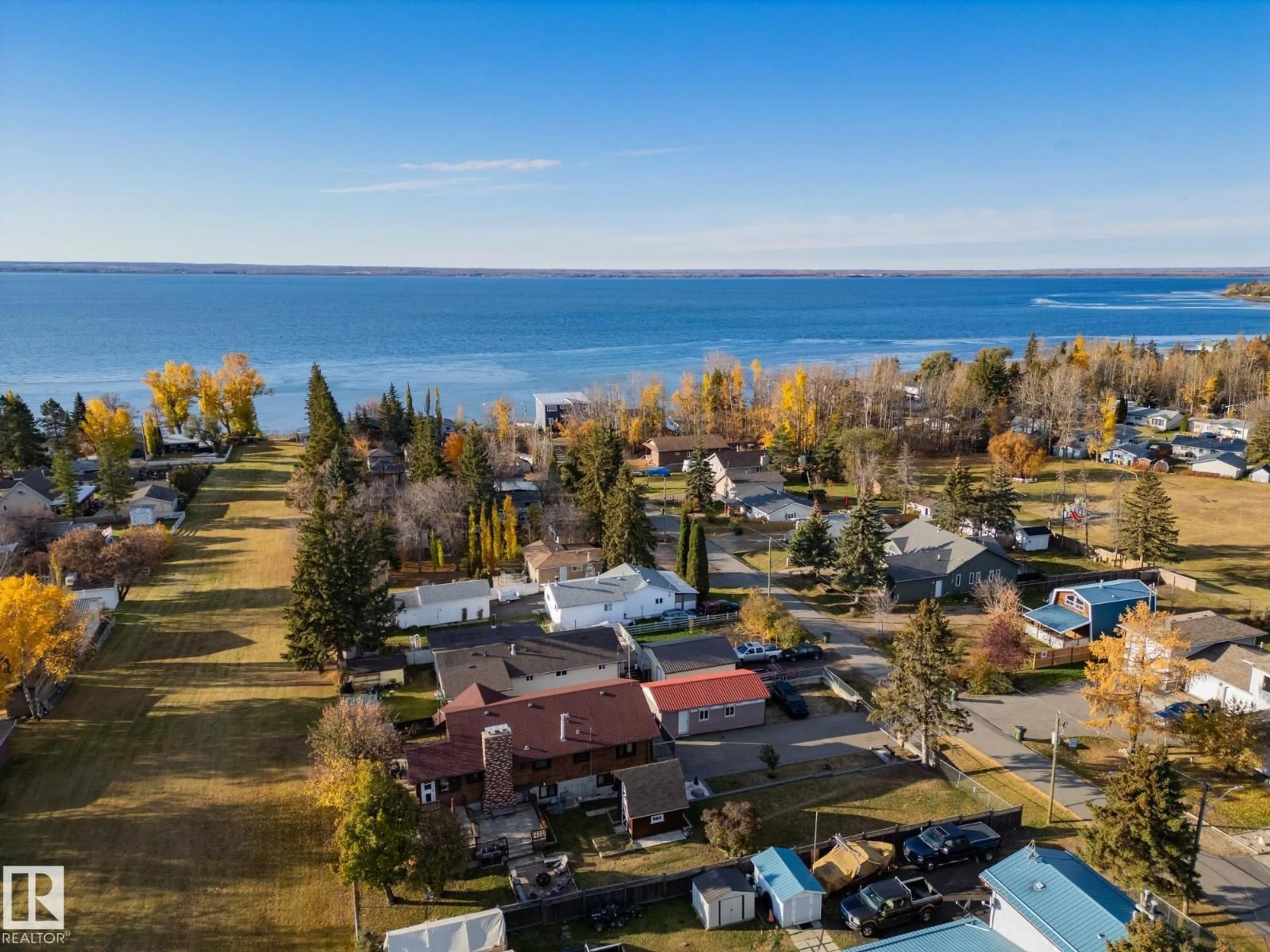 A pic from outside/outdoor area/front of a property/back of a property/a pic from drone, water/lake/river/ocean view for 403 4 ST, Rural Lac Ste. Anne County Alberta T0E1A0