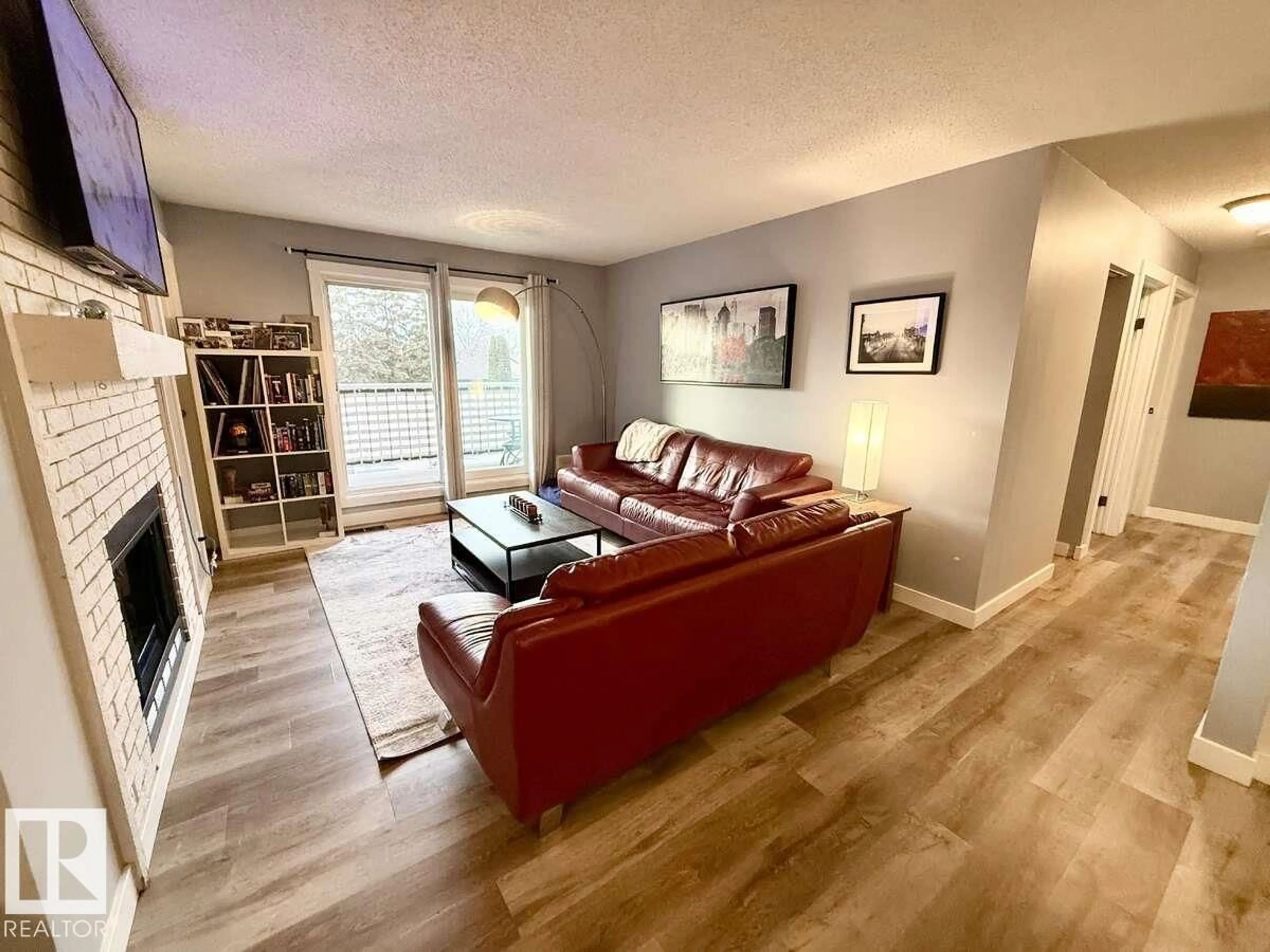 Living room with furniture, wood/laminate floor for 205 60 ALPINE PL, St. Albert Alberta T8N3Y2