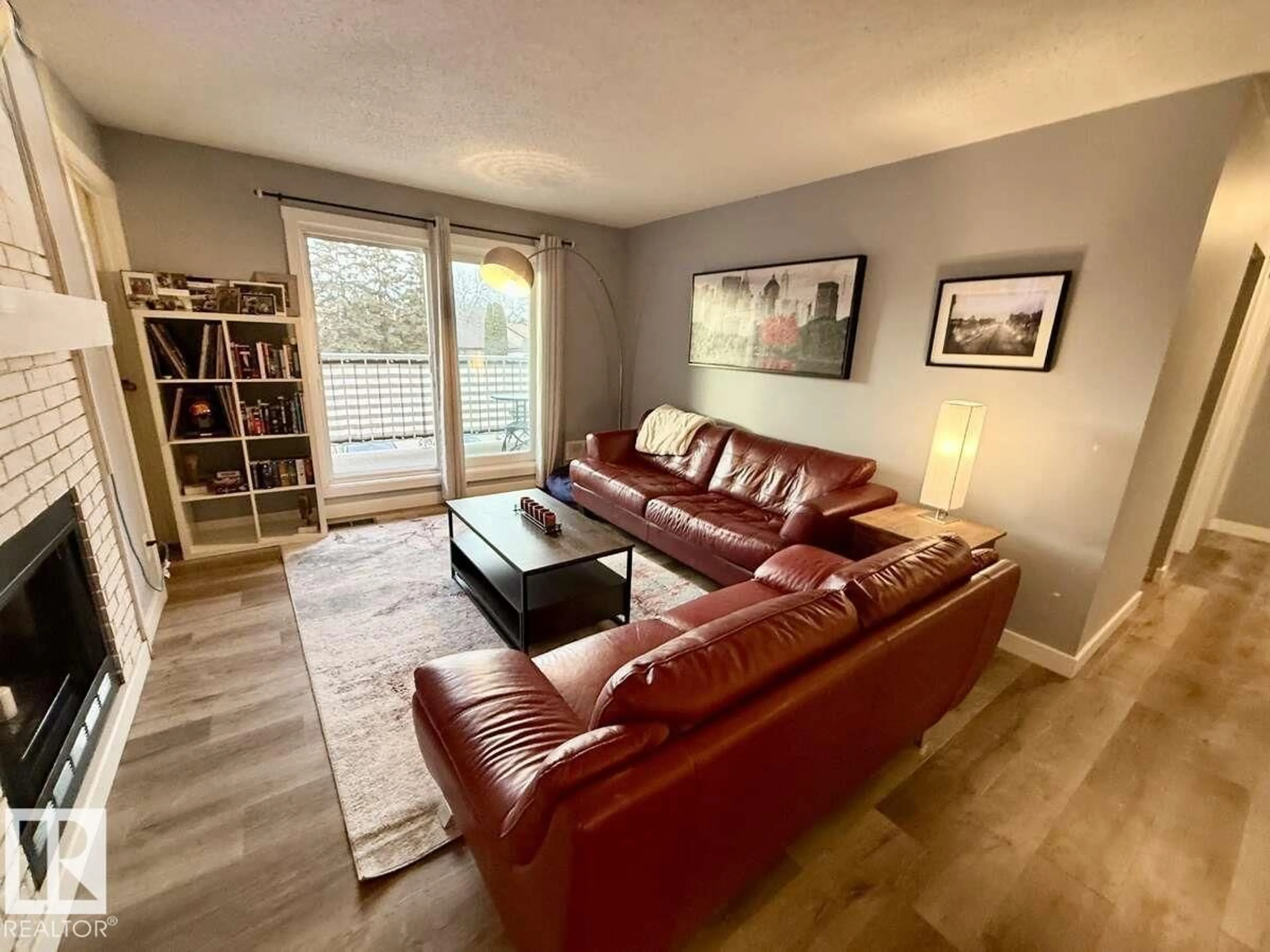 Living room with furniture, wood/laminate floor for 205 60 ALPINE PL, St. Albert Alberta T8N3Y2