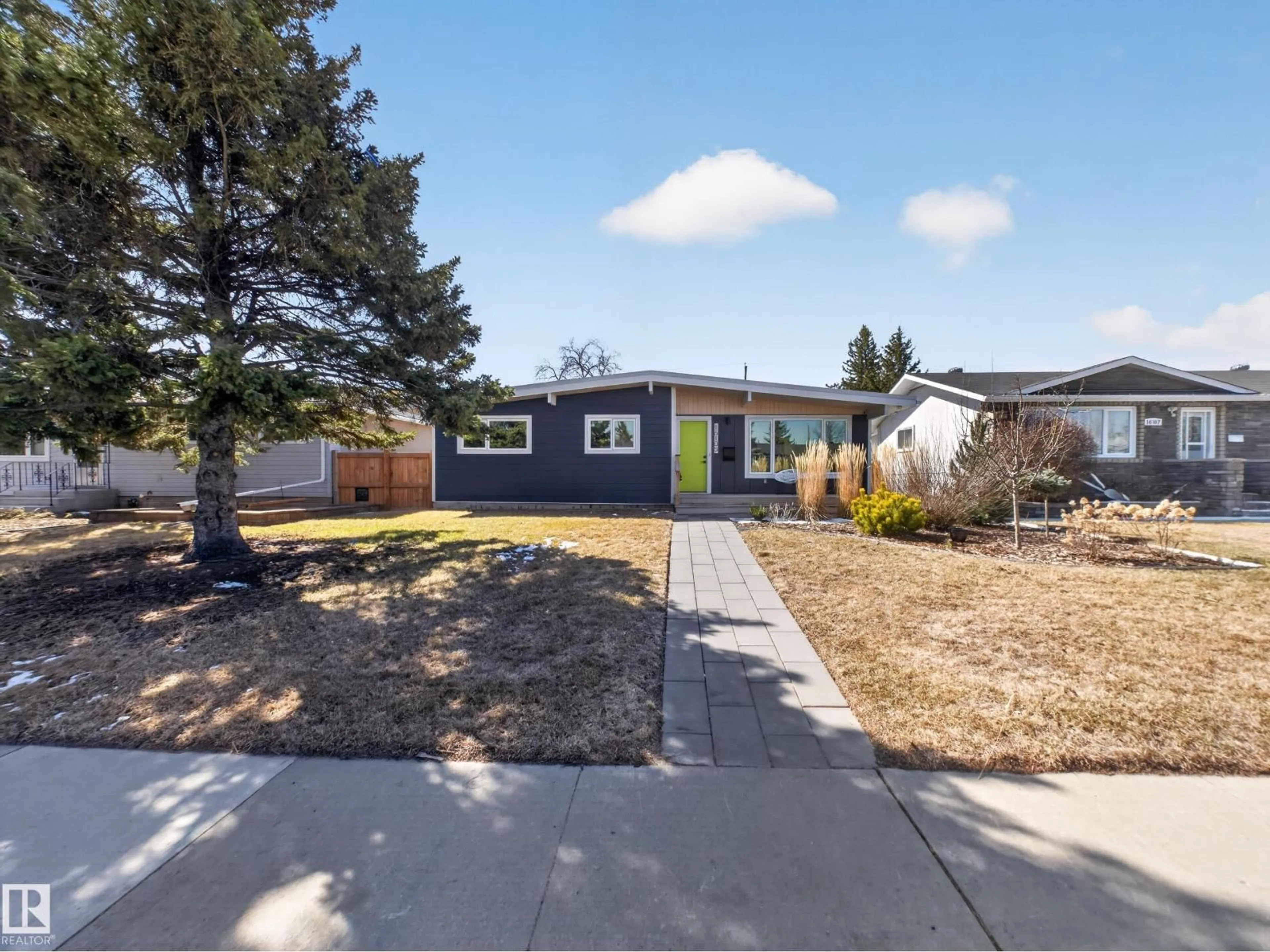 Home with vinyl exterior material, street for 16105 84 AV, Edmonton Alberta T5R3Y4