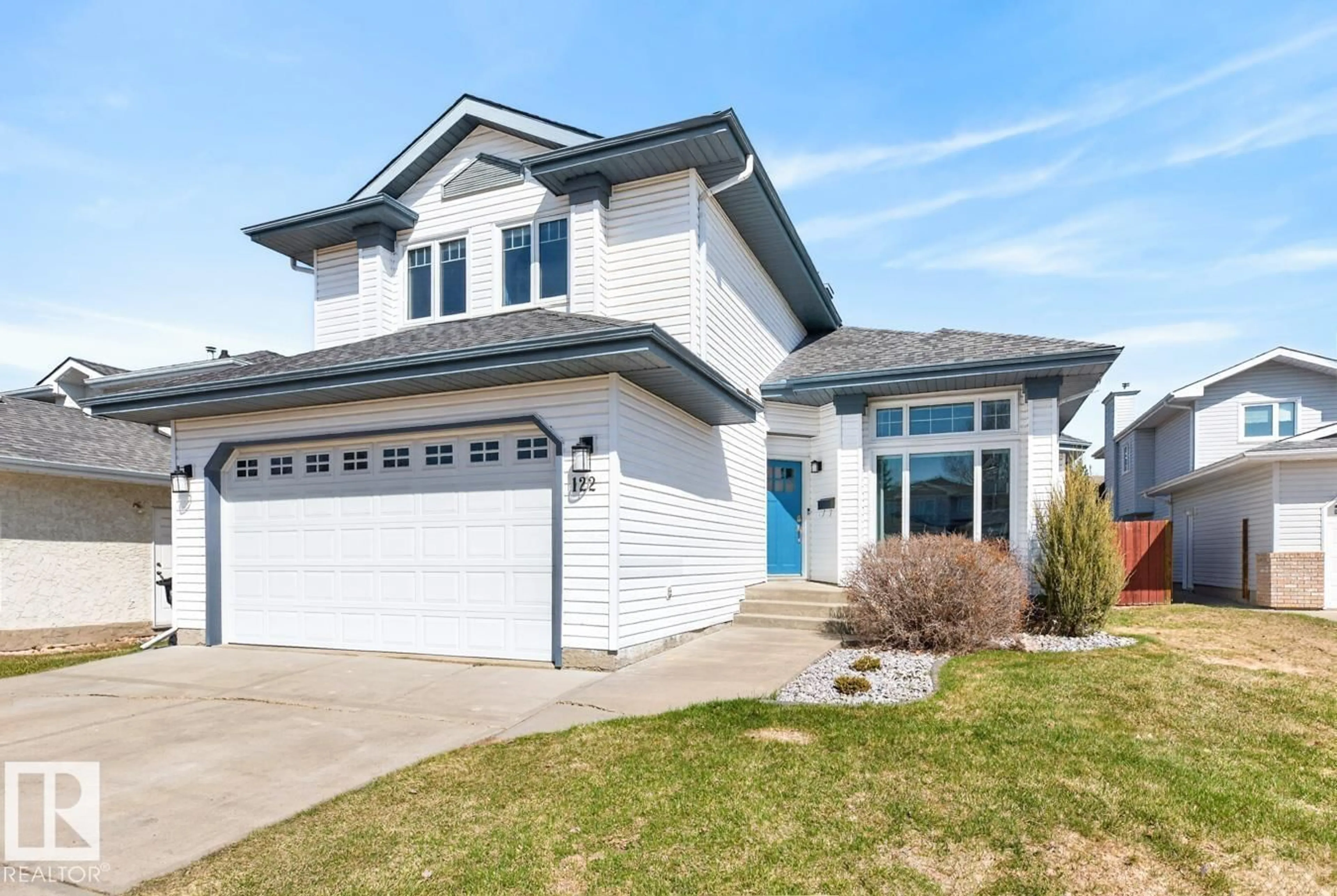 Home with vinyl exterior material, street for 122 CALICO DR, Sherwood Park Alberta T8A5P8