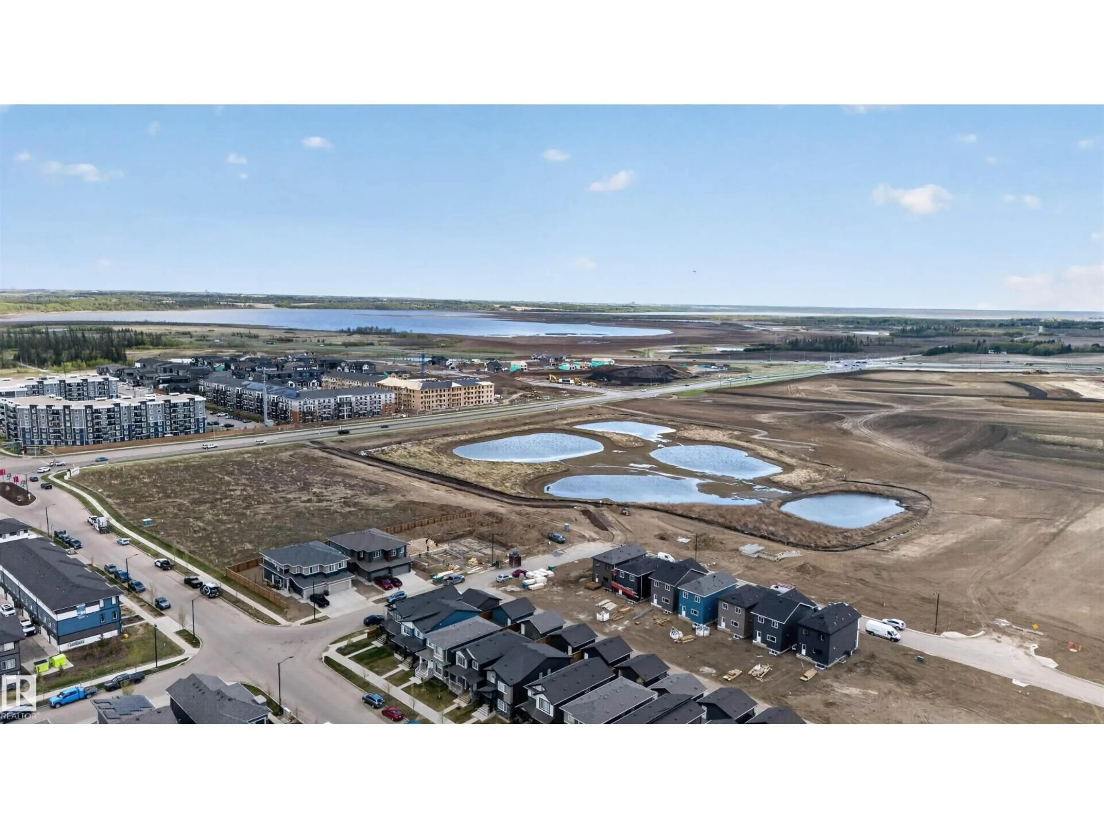 A pic from outside/outdoor area/front of a property/back of a property/a pic from drone, water/lake/river/ocean view for 45 RIVER BIRCH, St. Albert Alberta T8N7Y6