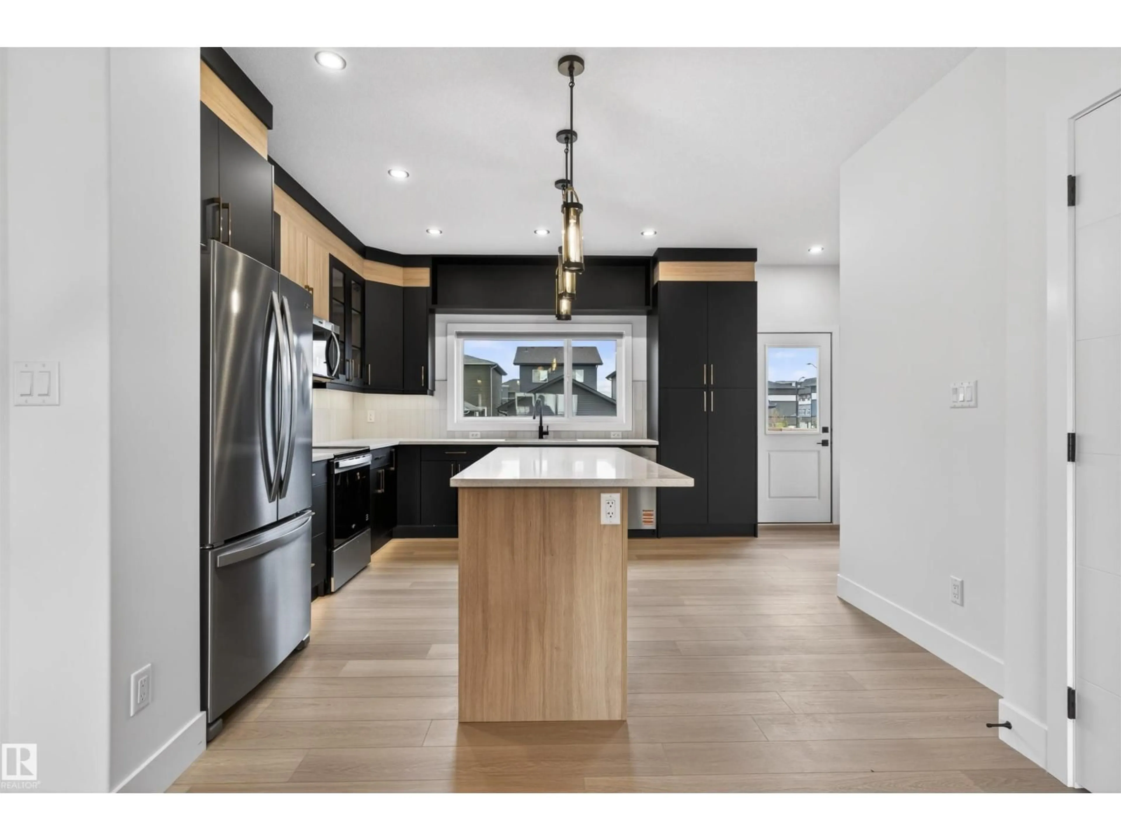 Open concept kitchen, wood/laminate floor for 45 RIVER BIRCH, St. Albert Alberta T8N7Y6