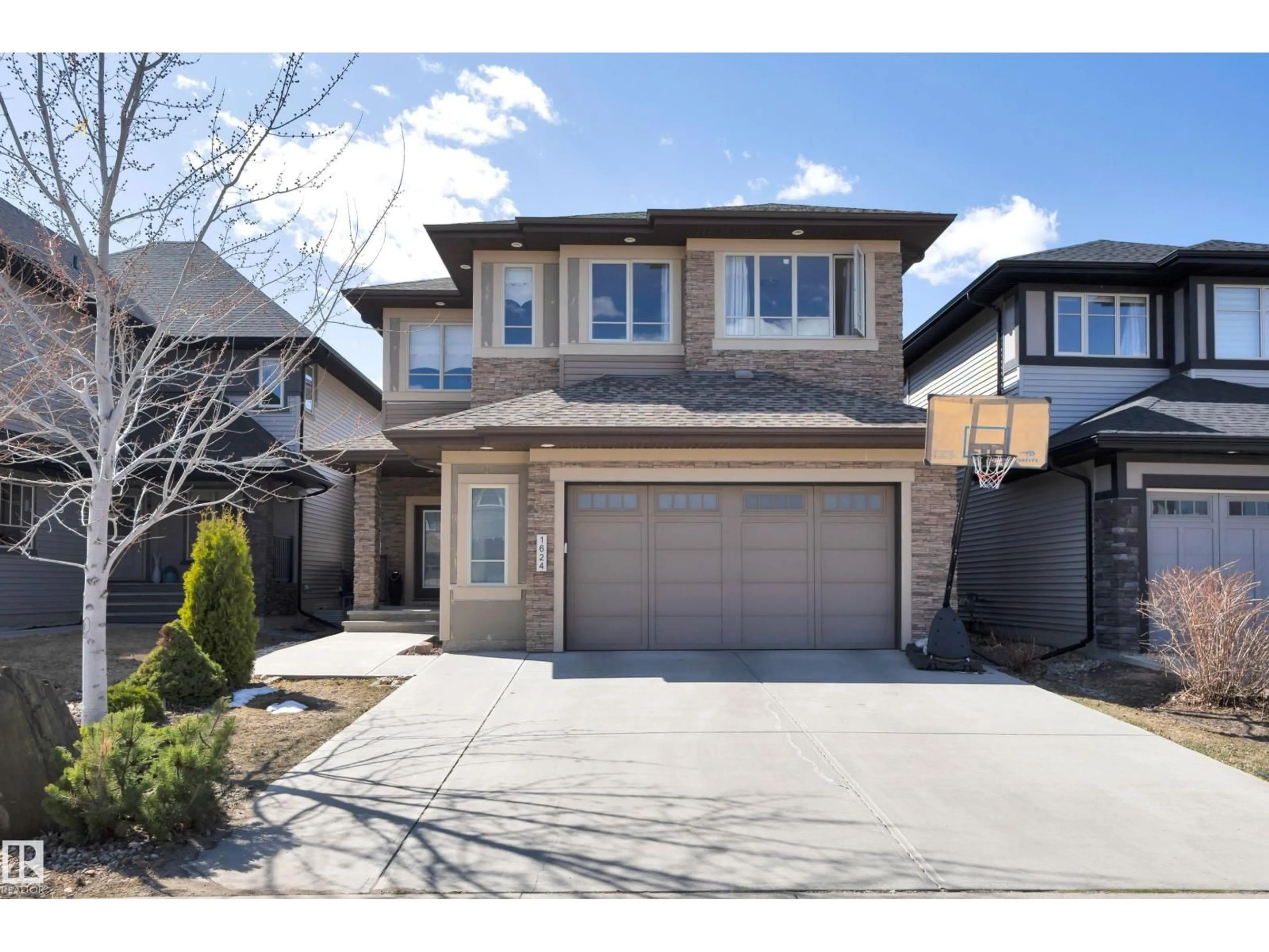 Home with vinyl exterior material, street for 1624 AINSLIE LN, Edmonton Alberta T6W0H5