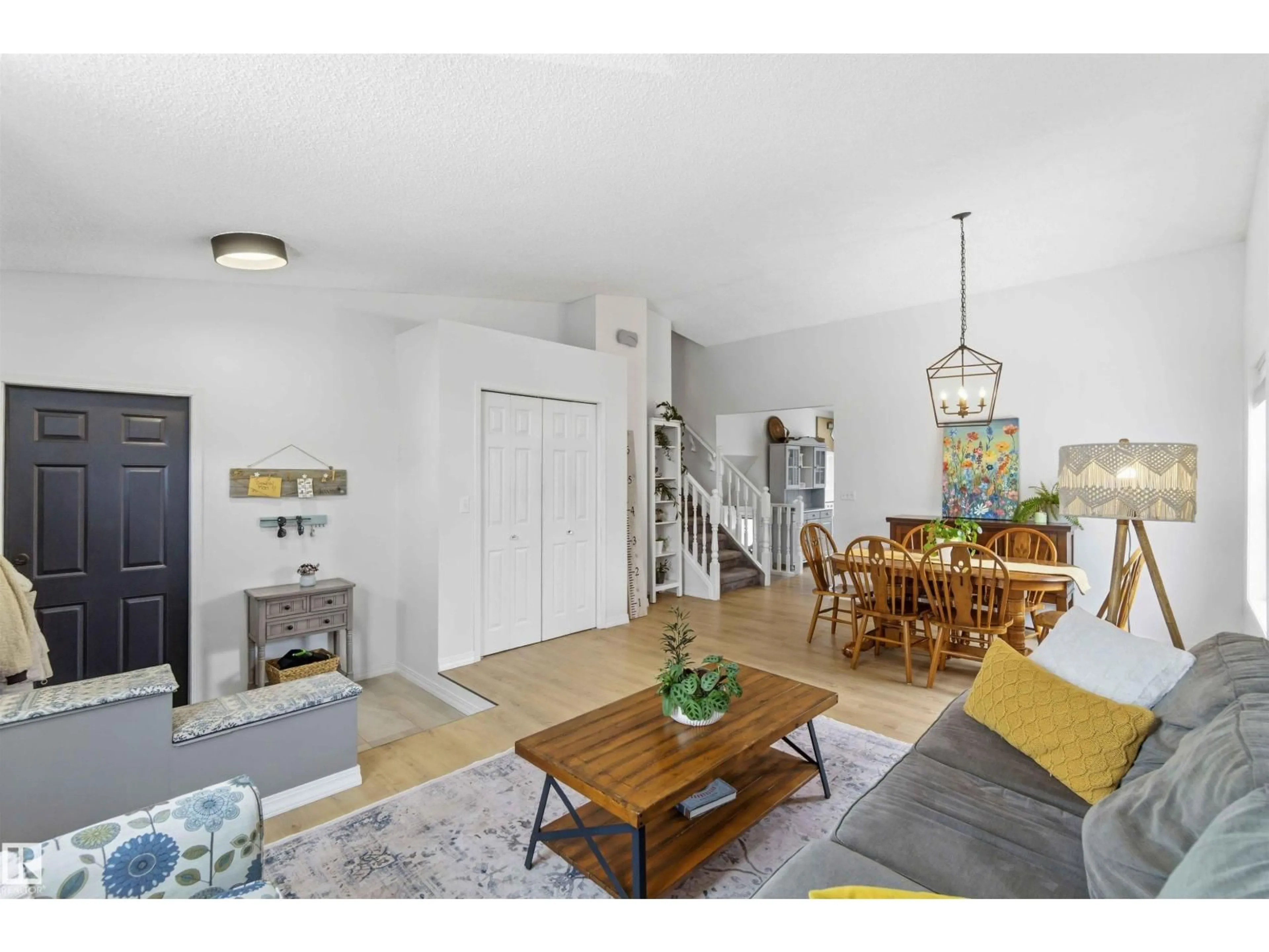 Living room with furniture, wood/laminate floor for 22 DONAHUE CL, St. Albert Alberta T8N5N7