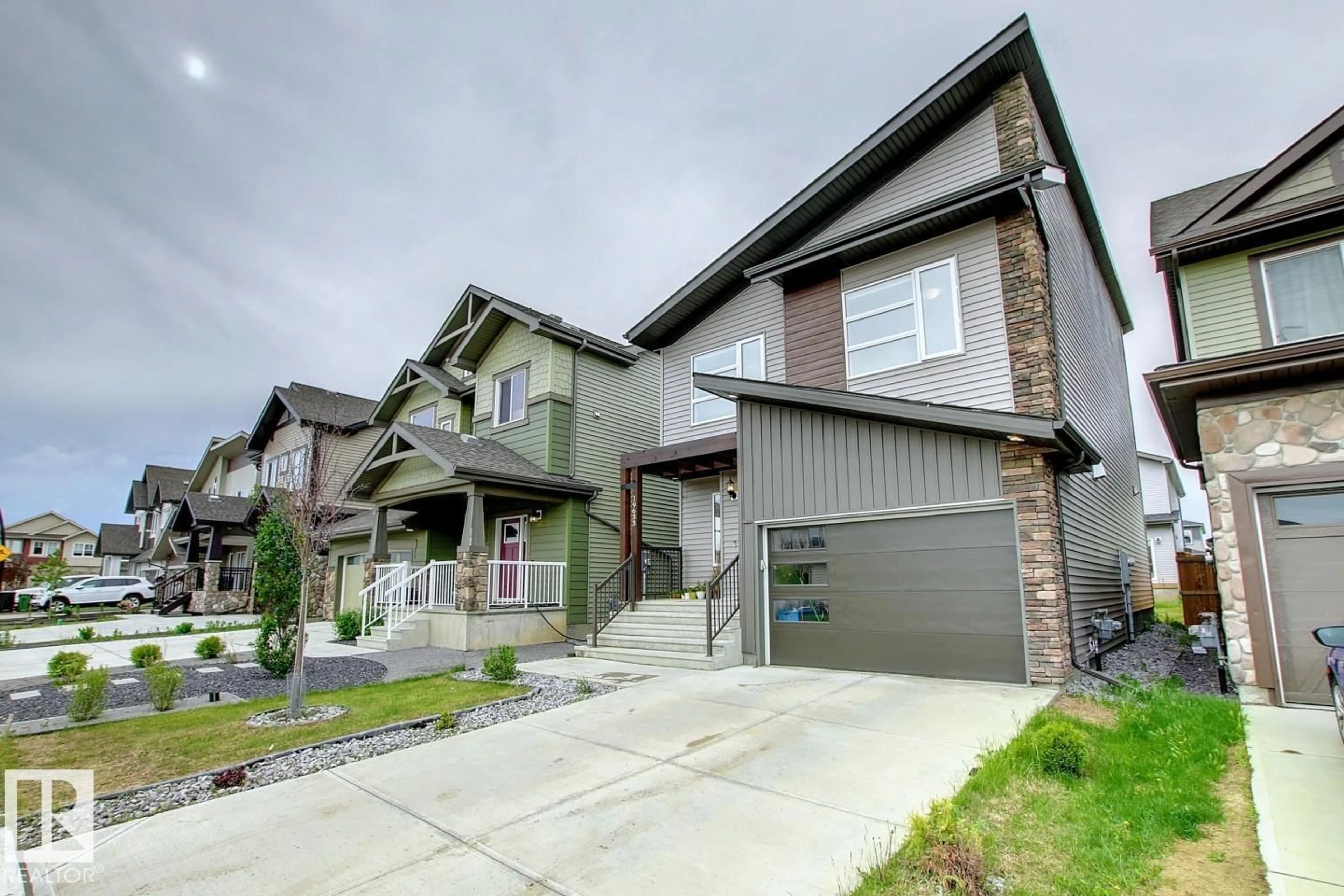 Home with vinyl exterior material, street for 19633 26A AV AV, Edmonton Alberta T6M0X3
