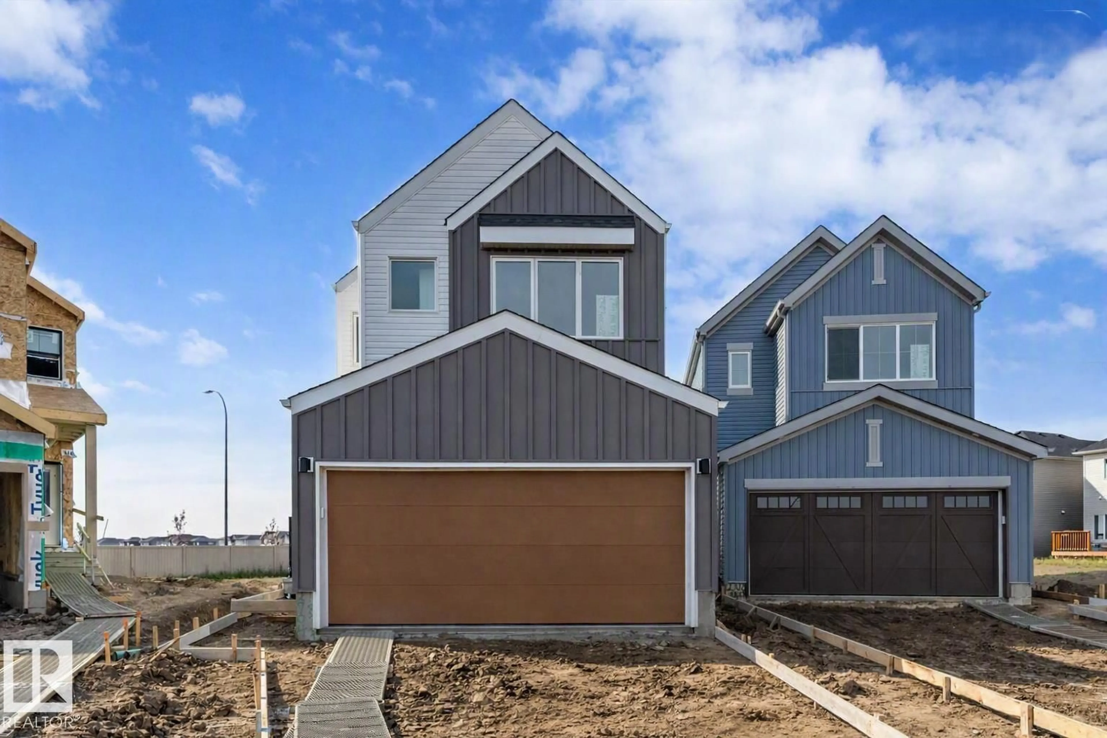 Home with vinyl exterior material, street for NW - 2704 188 ST, Edmonton Alberta T6M3J1