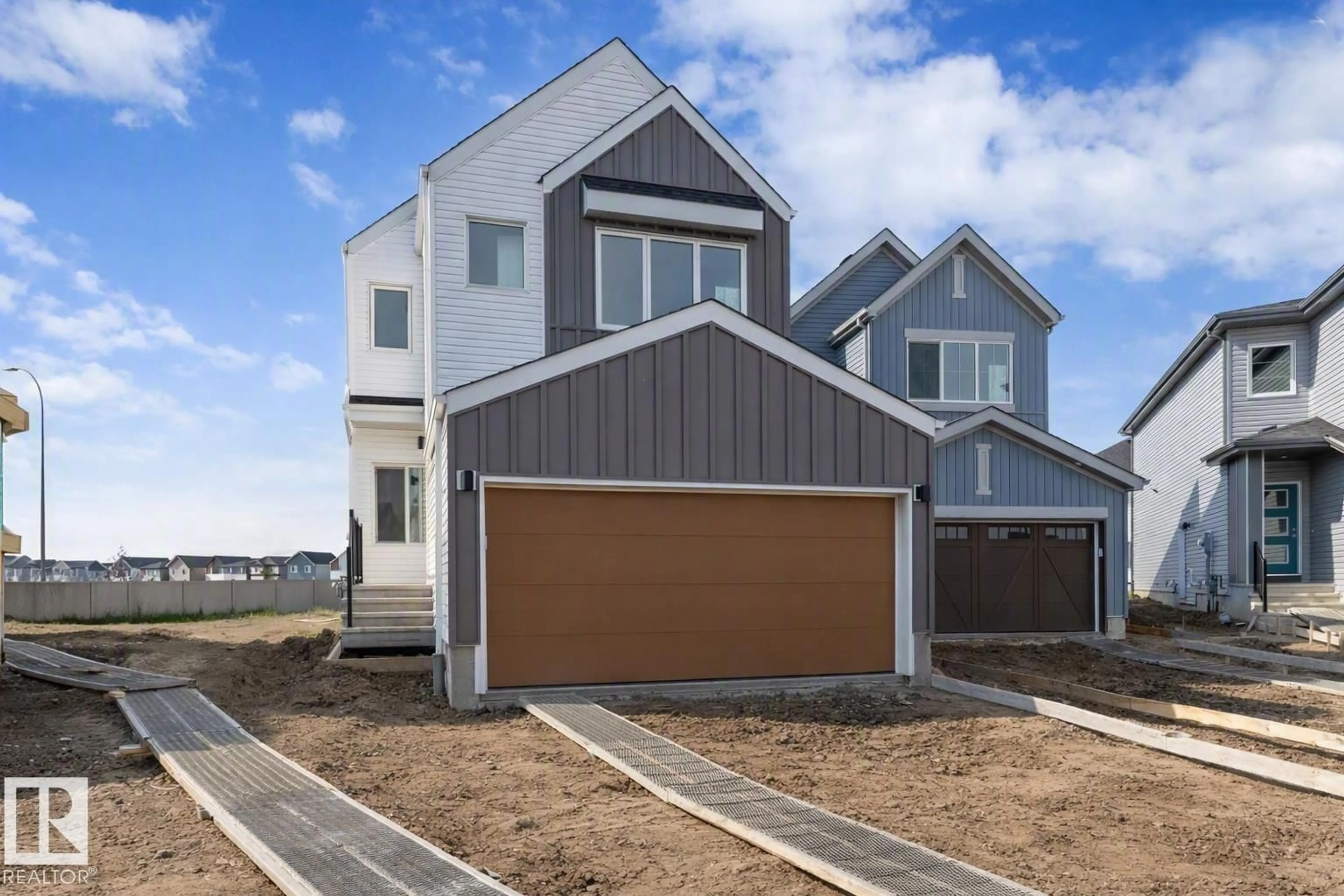 Home with vinyl exterior material, street for NW - 2704 188 ST, Edmonton Alberta T6M3J1