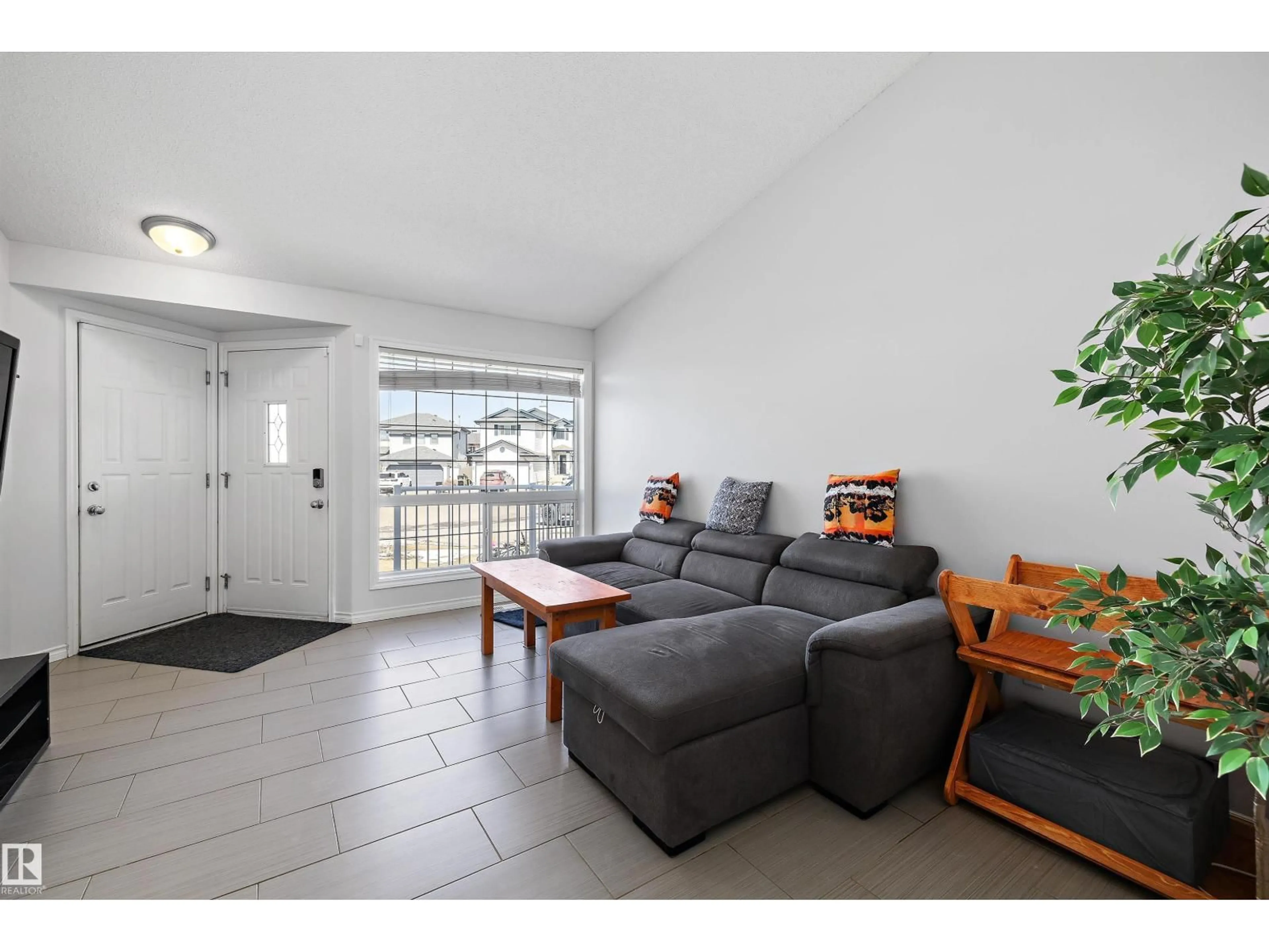 Living room with furniture, unknown for 1811 37 AV, Edmonton Alberta T6T1S6