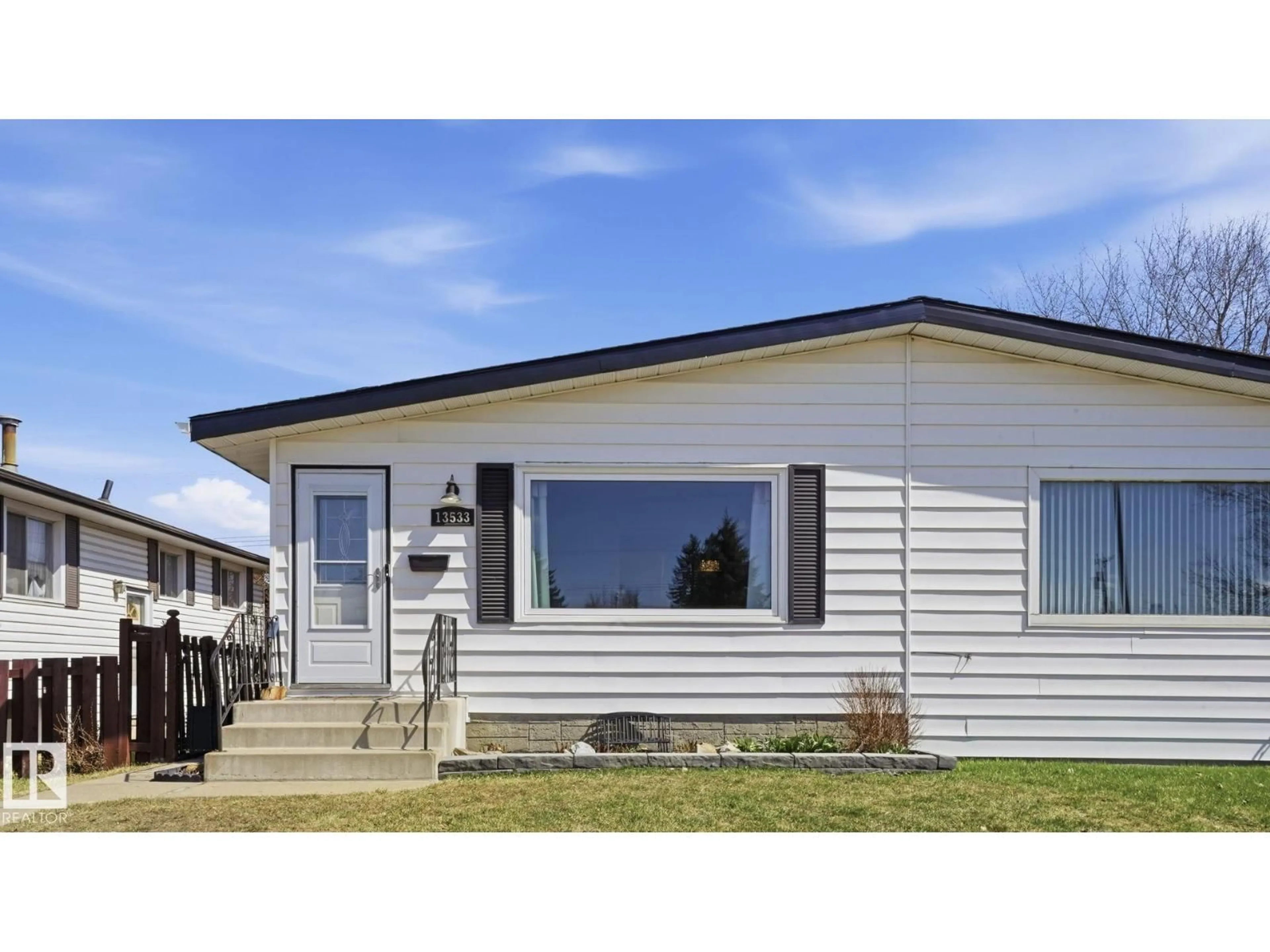 Home with vinyl exterior material, street for 13533 119 ST, Edmonton Alberta T5E5M9