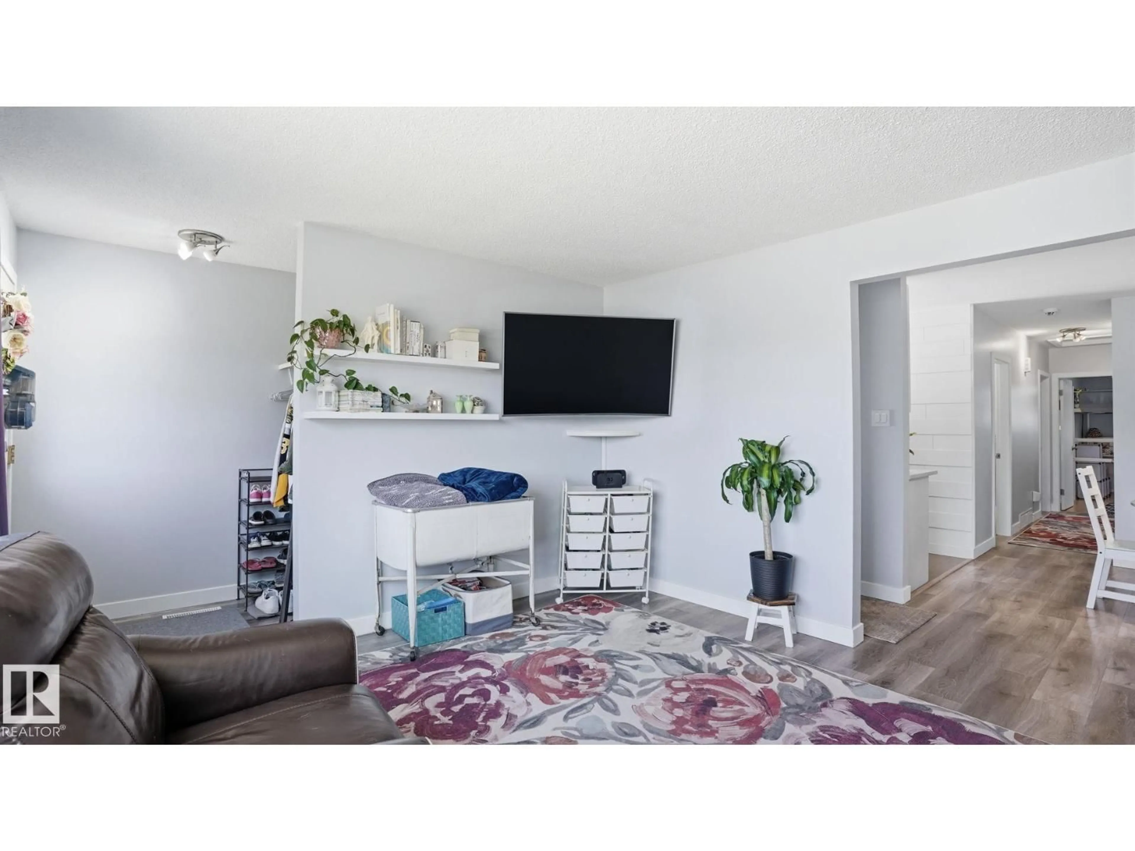 Living room with furniture, wood/laminate floor for 13533 119 ST, Edmonton Alberta T5E5M9