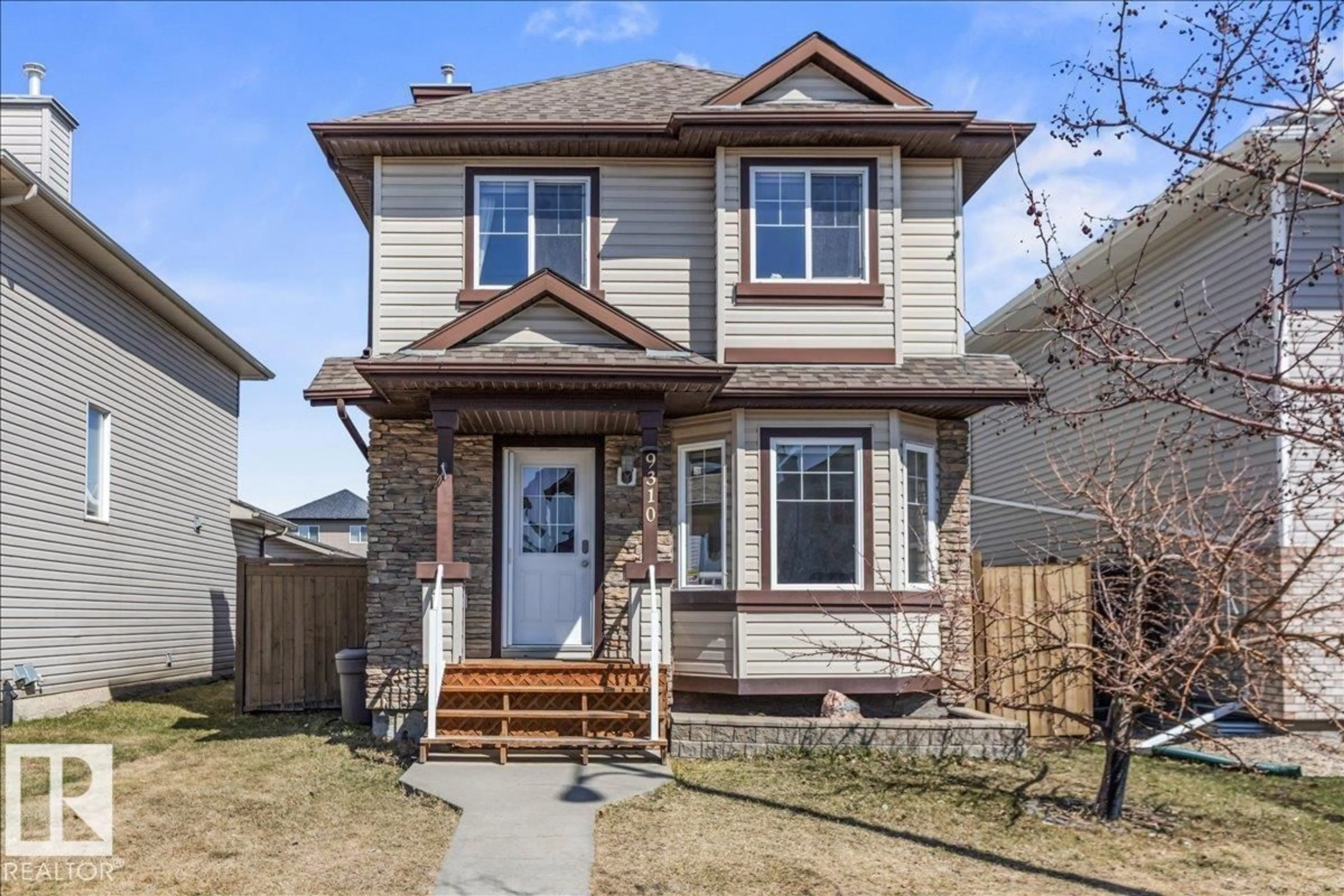 Home with vinyl exterior material, street for 9310 SIMPSON DR, Edmonton Alberta T6R0E4