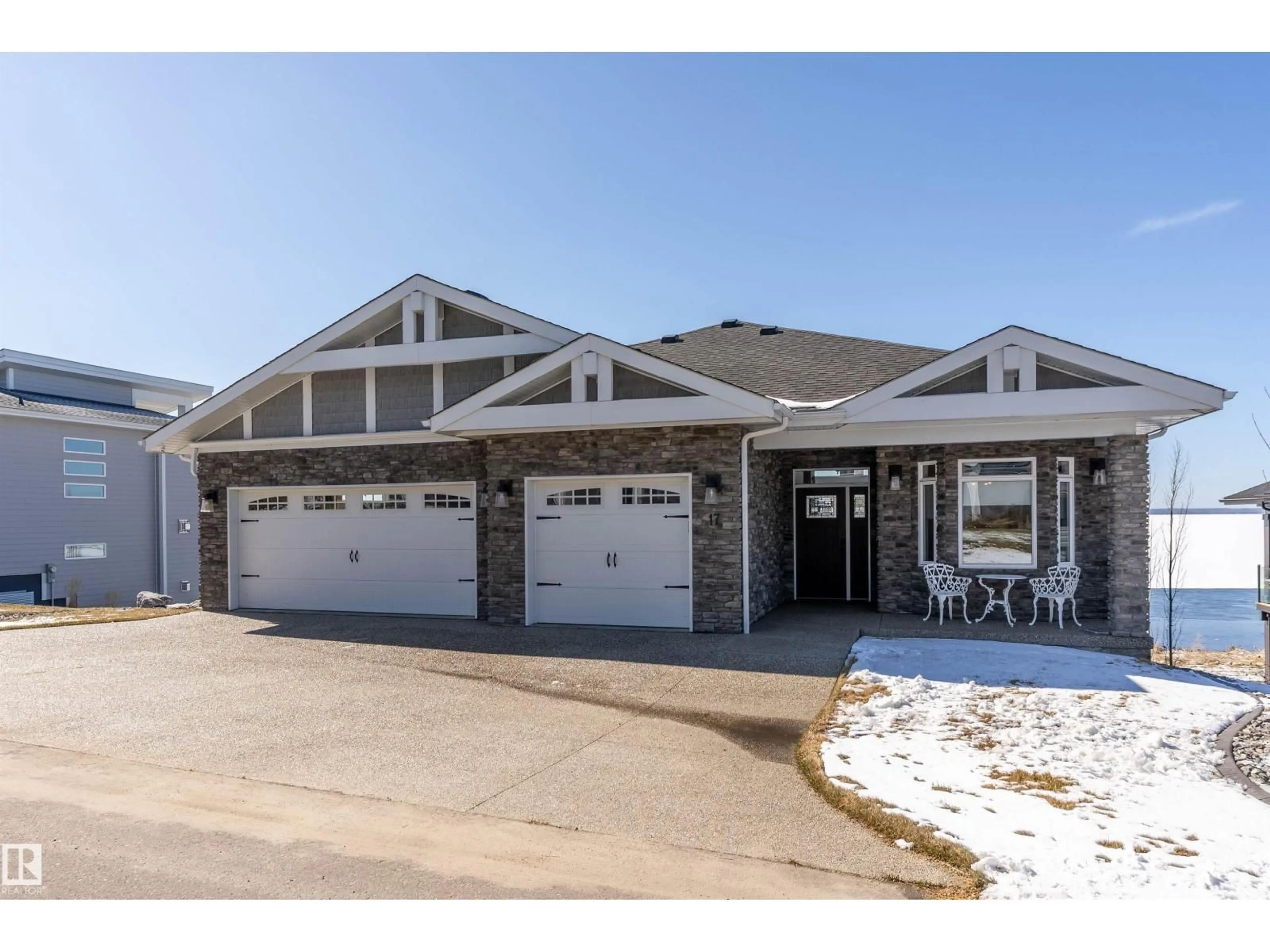 Home with brick exterior material, street for 17 - 55101 STE. ANNE TR, Rural Lac Ste. Anne County Alberta T0E0A0