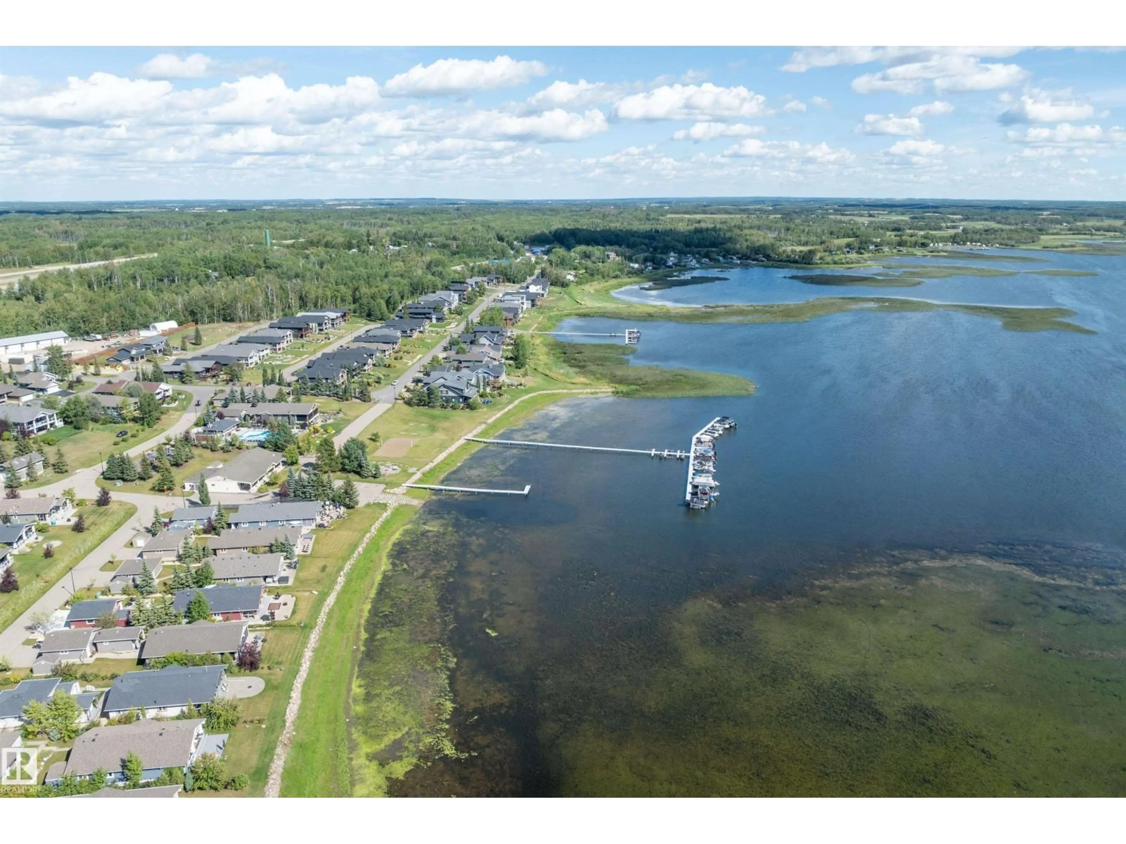 A pic from outside/outdoor area/front of a property/back of a property/a pic from drone, water/lake/river/ocean view for 17 - 55101 STE. ANNE TR, Rural Lac Ste. Anne County Alberta T0E0A0