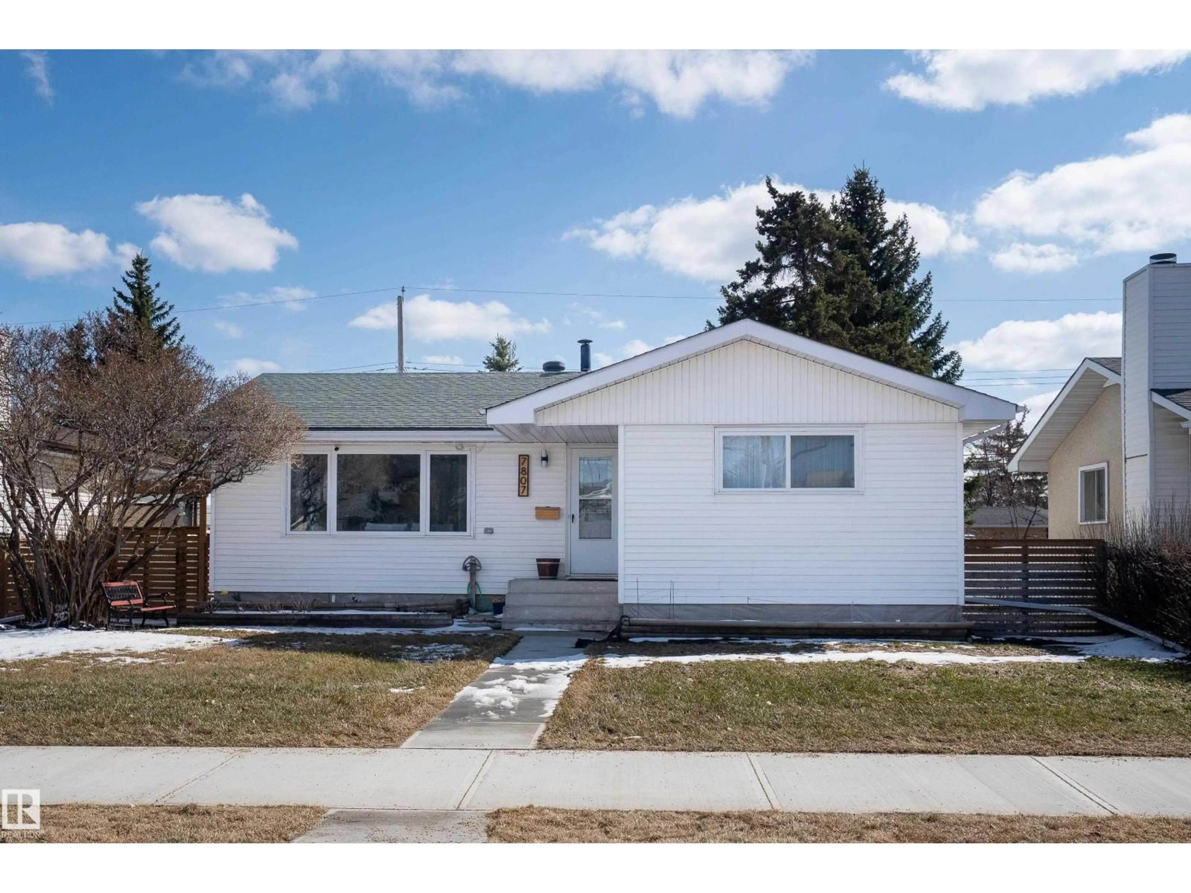 Home with vinyl exterior material, street for 7807 132 AV, Edmonton Alberta T5C2B2