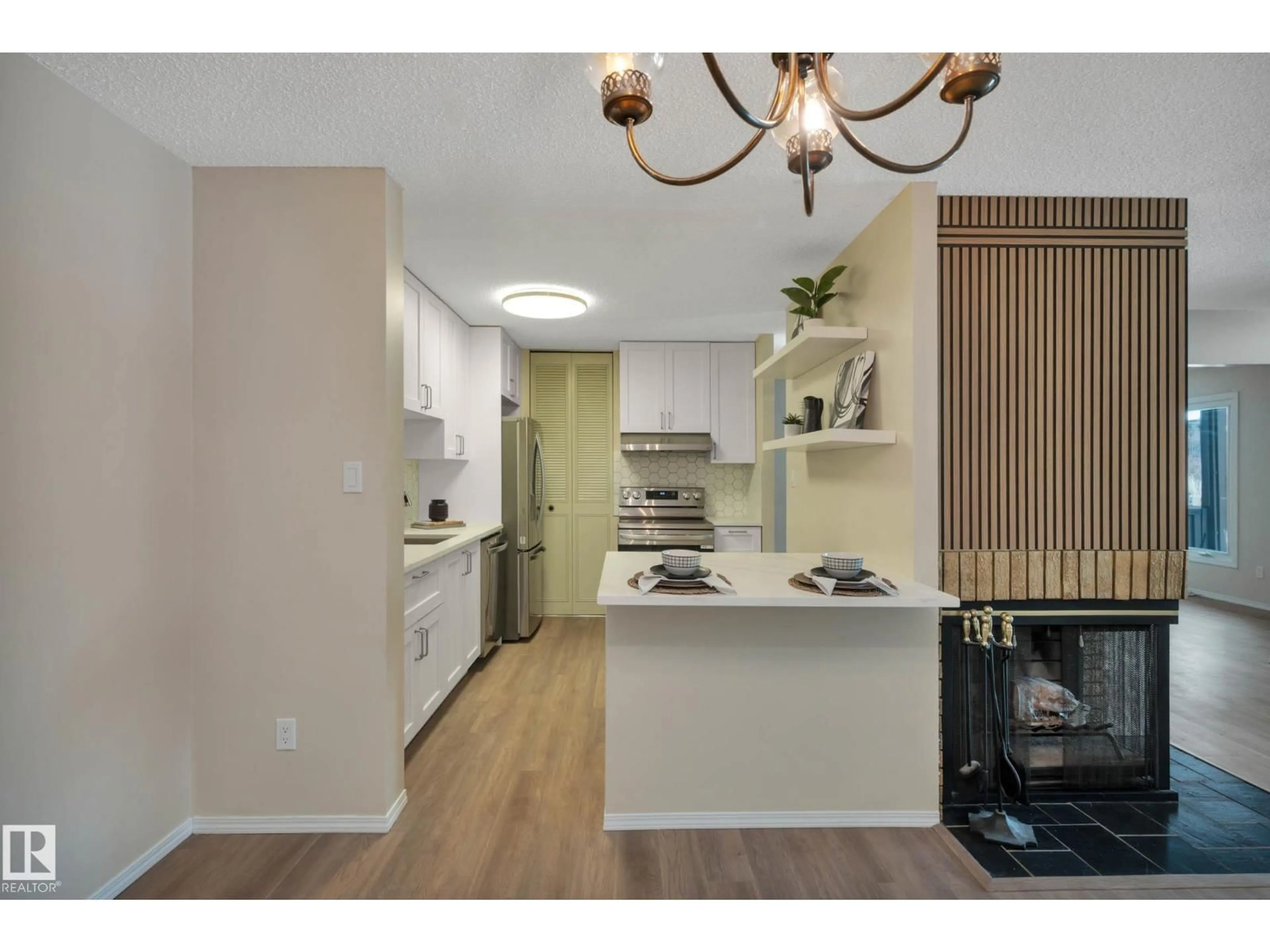 Open concept kitchen, wood/laminate floor for 248 SURREY GARDENS GD, Edmonton Alberta T5T1Z3