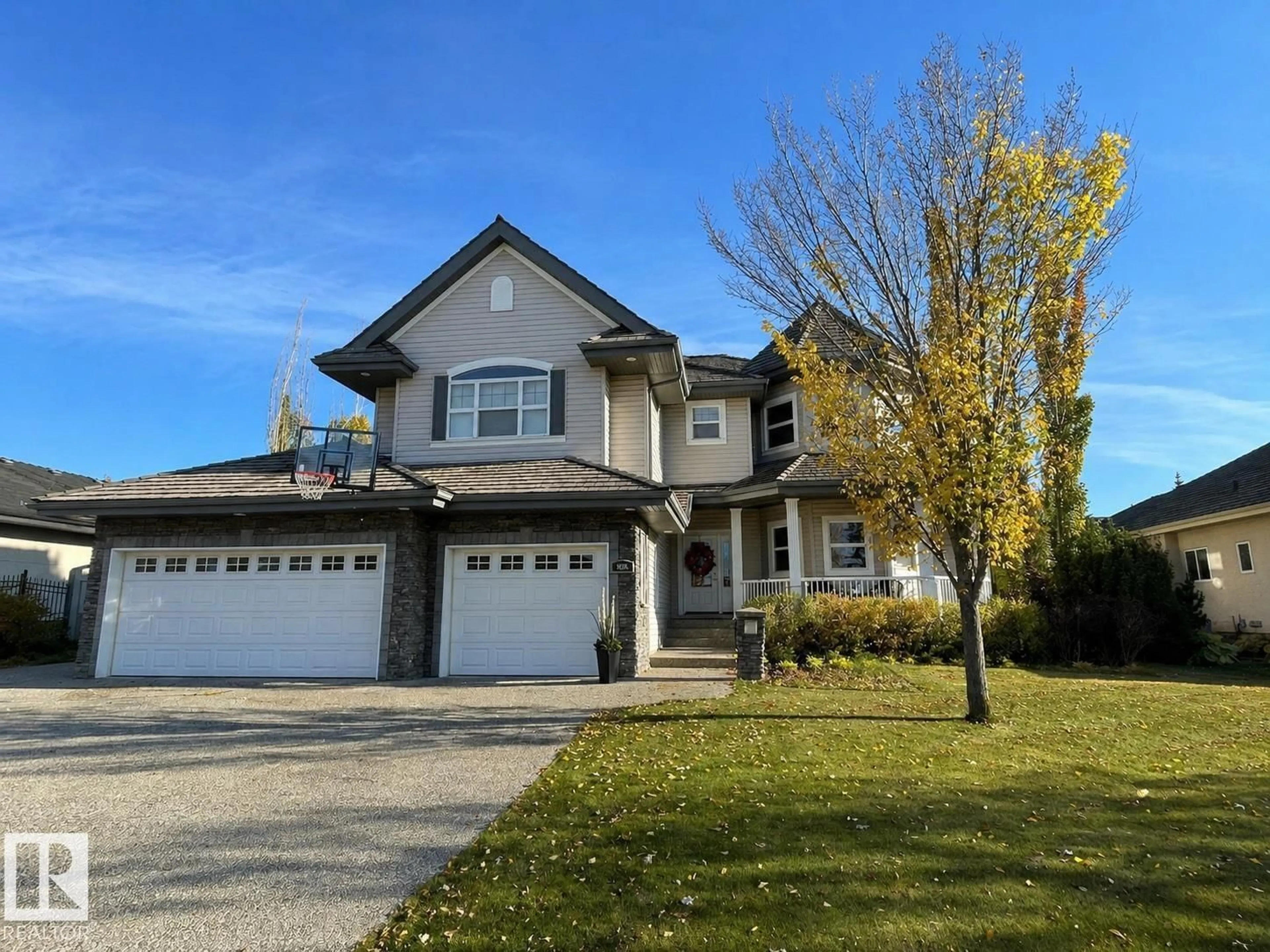 Home with vinyl exterior material, street for 52328 - 559 RGE ROAD 233, Rural Strathcona County Alberta T5B0A2