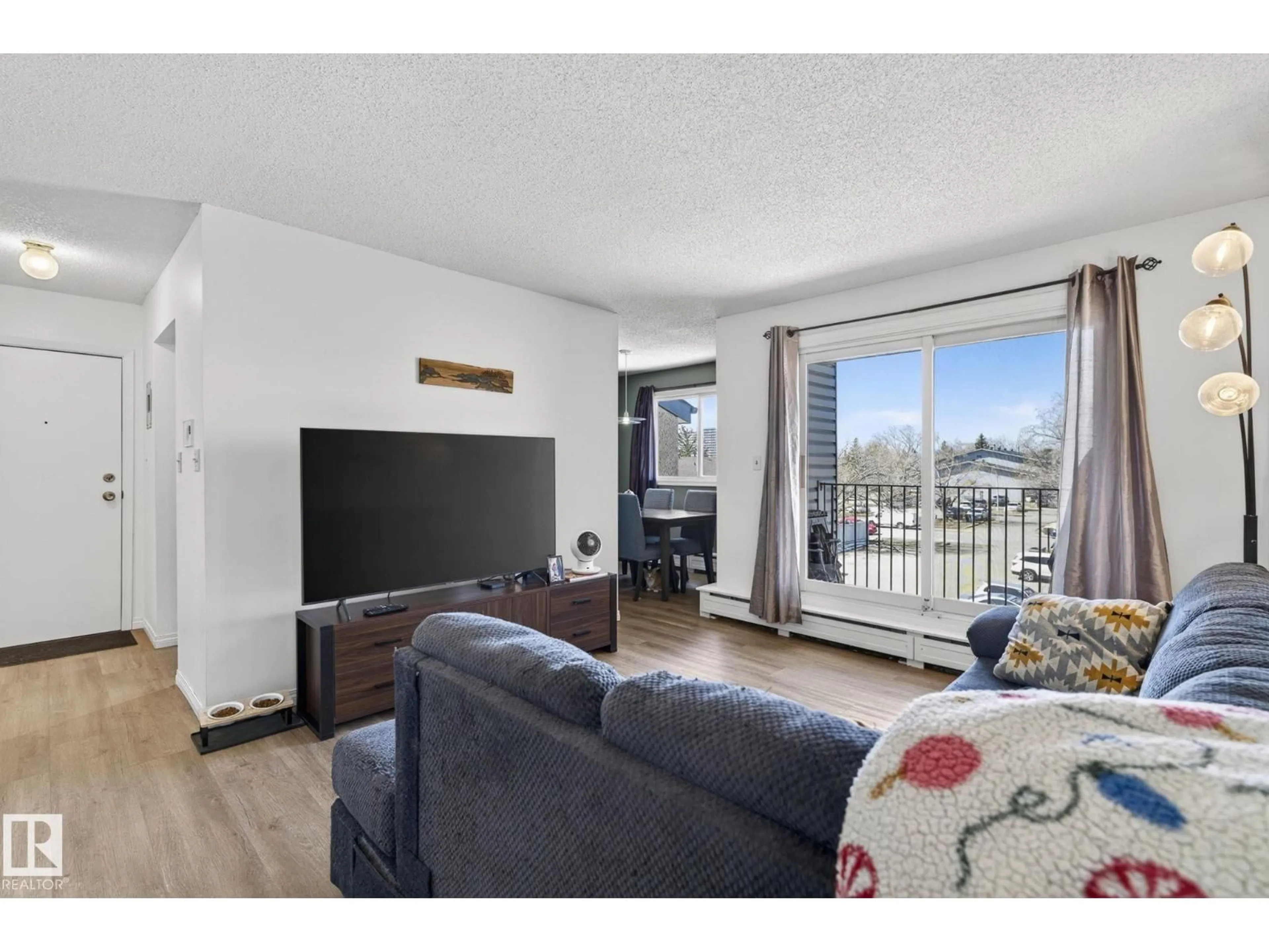 Living room with furniture, wood/laminate floor for 301 - 7203 171 ST NW, Edmonton Alberta T5T2R1