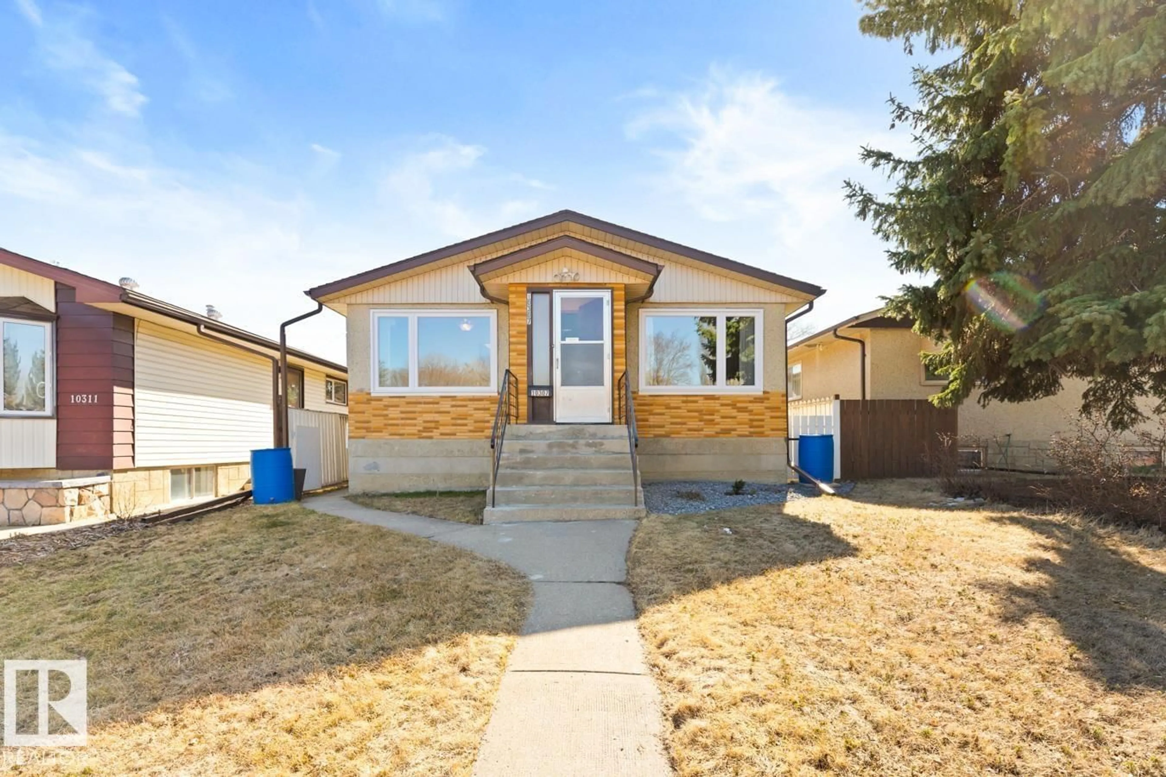 Home with vinyl exterior material, street for NW - 10307 73 ST, Edmonton Alberta T6A2X3