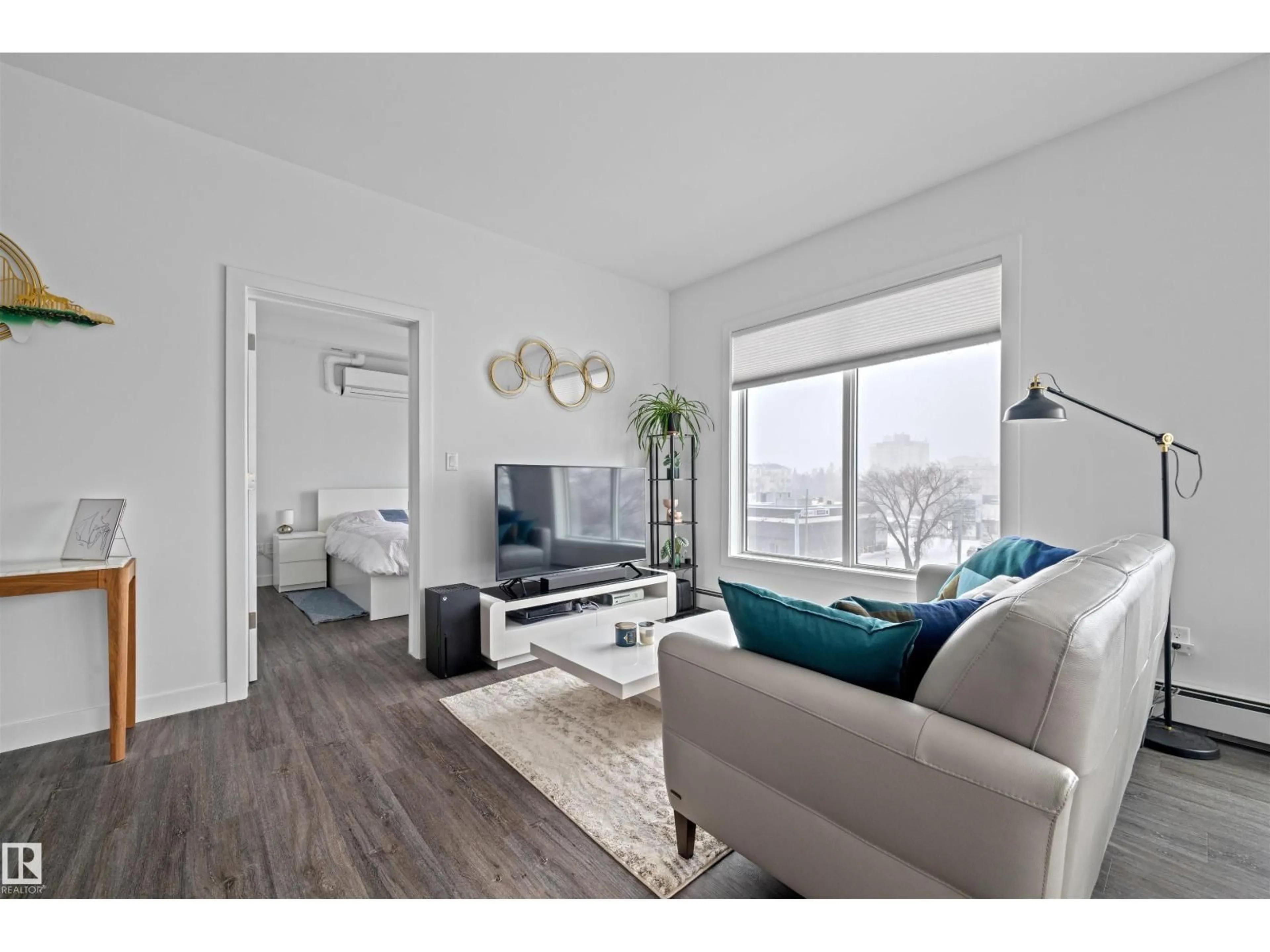 Living room with furniture, wood/laminate floor for #408 - 10837 83 AV, Edmonton Alberta T6E2E6
