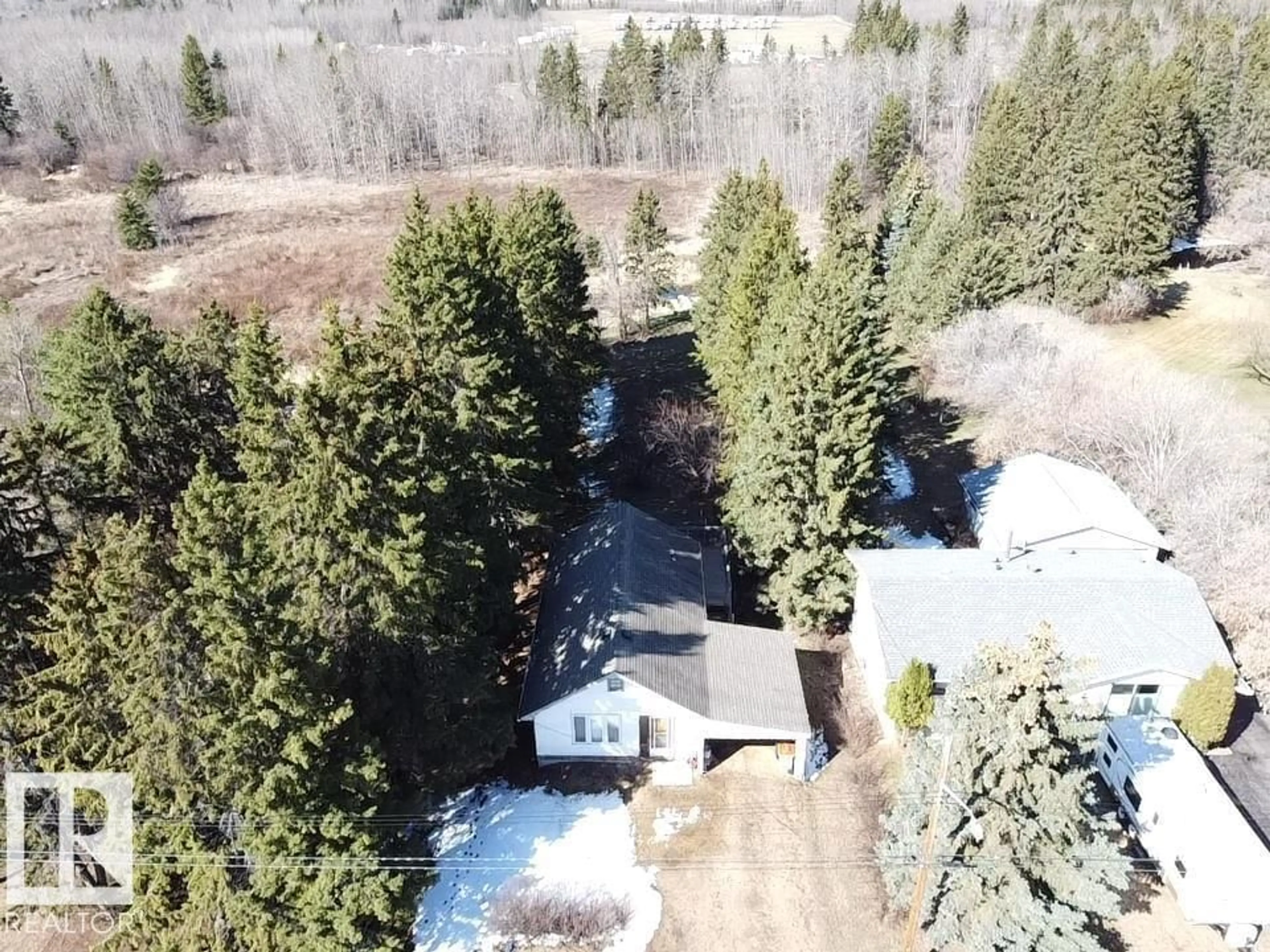 A pic from outside/outdoor area/front of a property/back of a property/a pic from drone, forest/trees view for 5108 52 ST, Millet Alberta T0Z1Z0