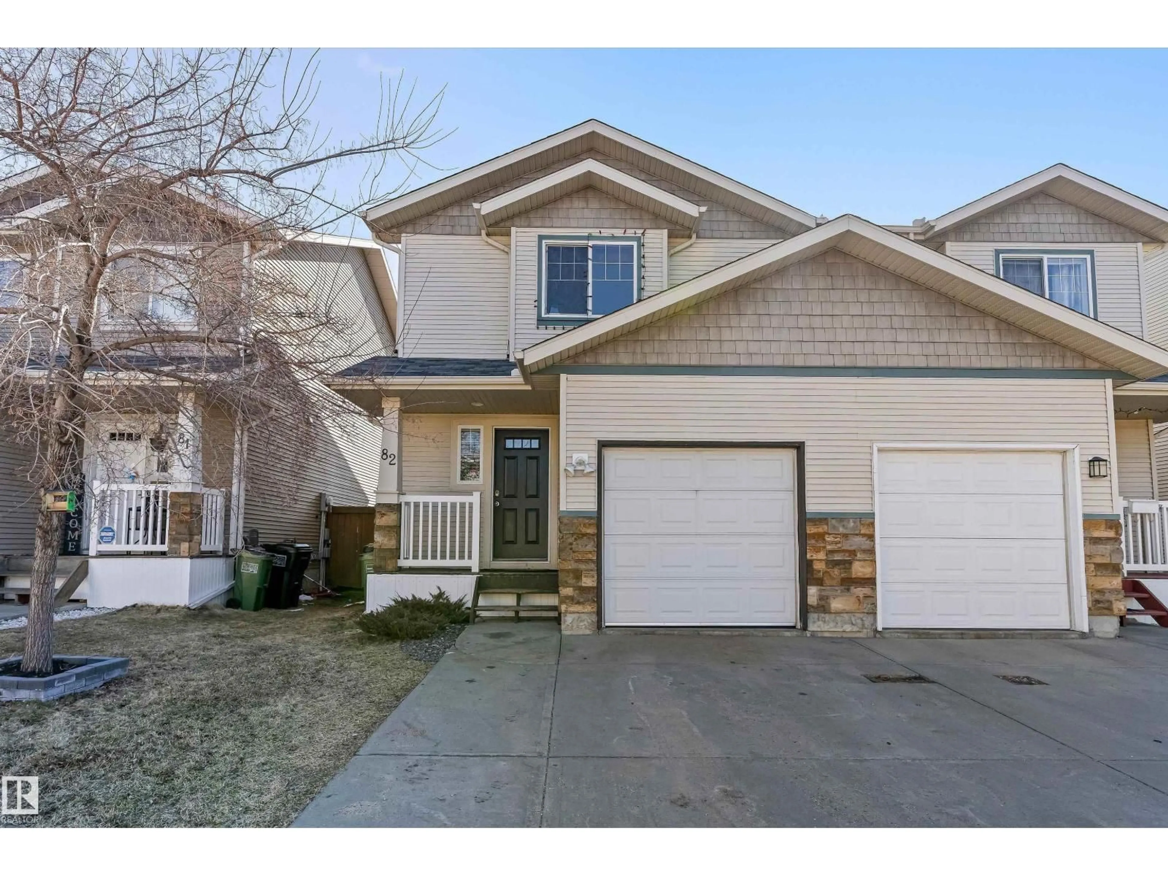 Home with vinyl exterior material, street for NW - 82 14208 ST, Edmonton Alberta T5Y0E4