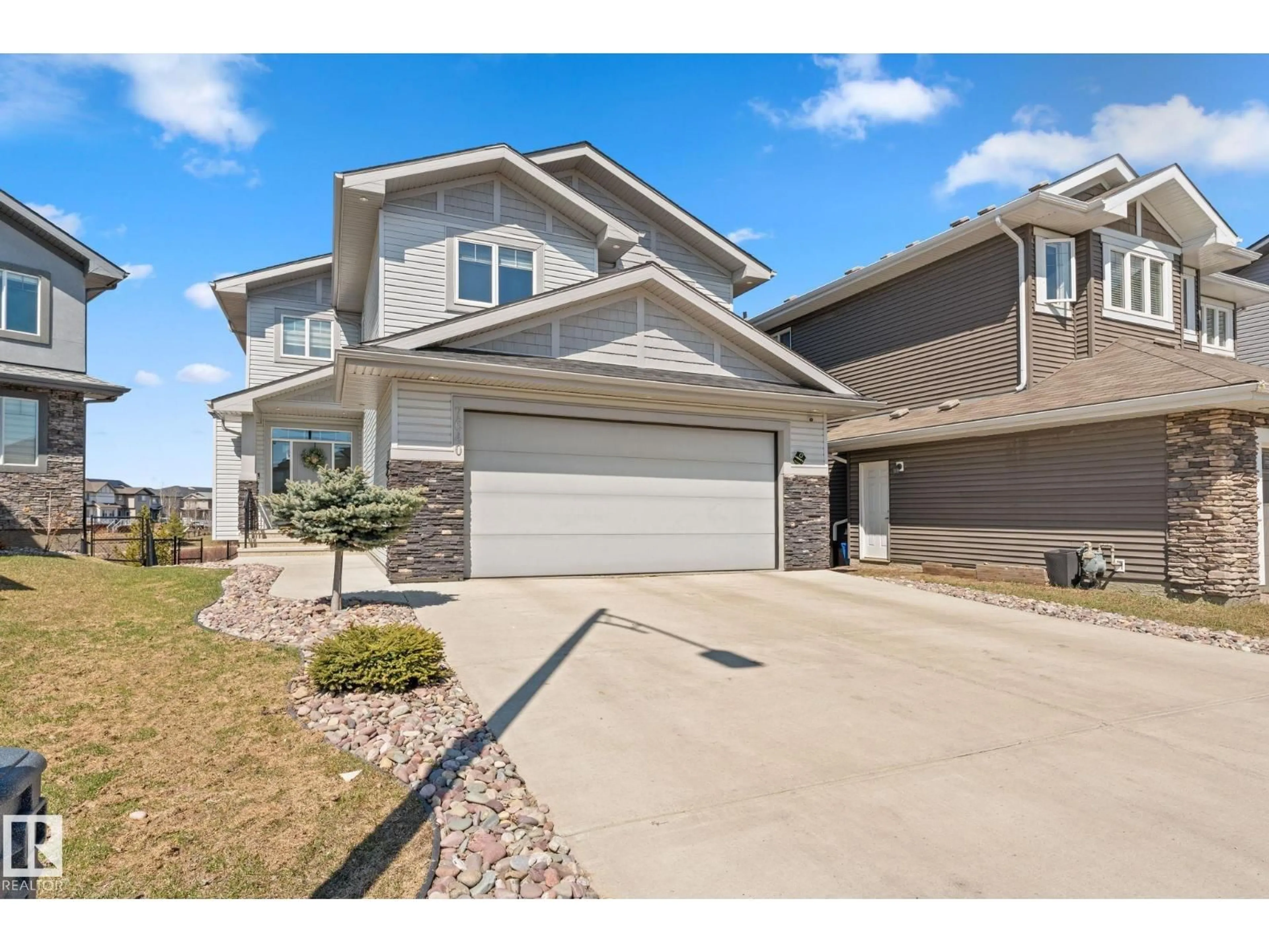Home with vinyl exterior material, street for 7640 179 AV NW, Edmonton Alberta T5Z0L2