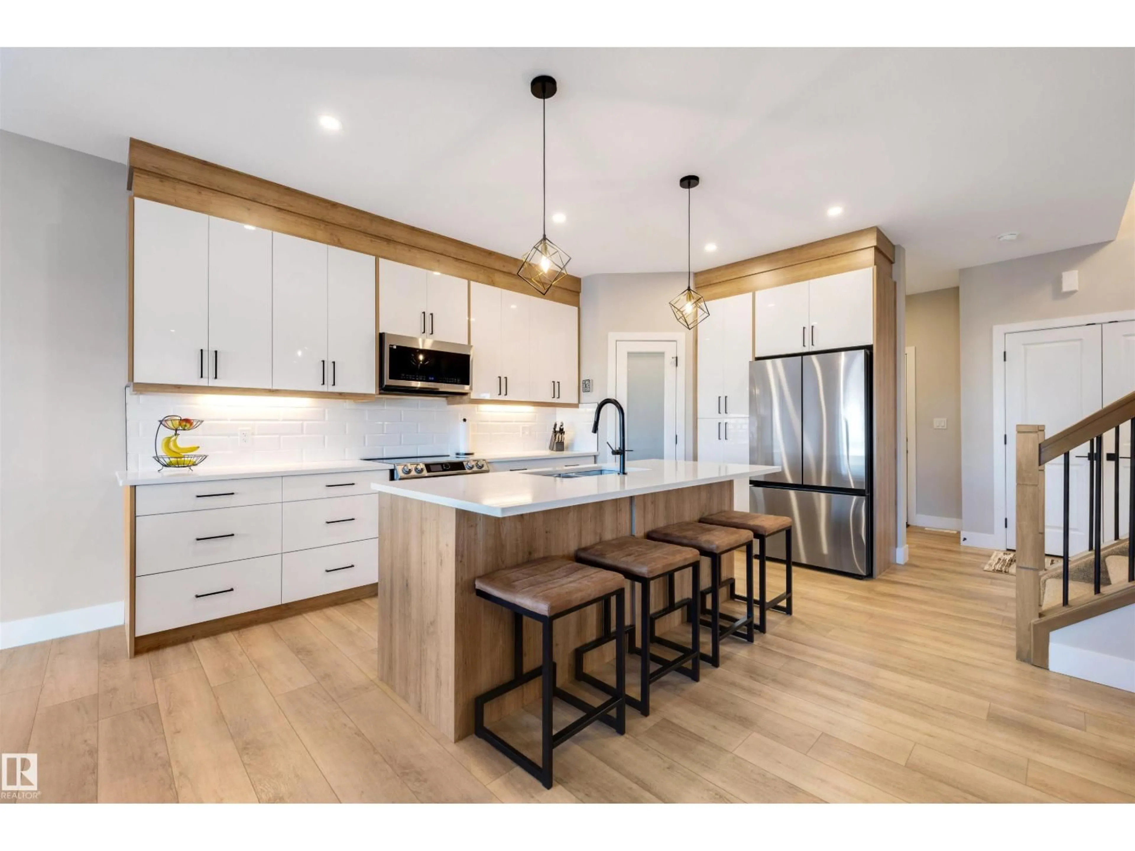 Open concept kitchen, wood/laminate floor for 12 AMBERLEY BA, Spruce Grove Alberta T7X2X4