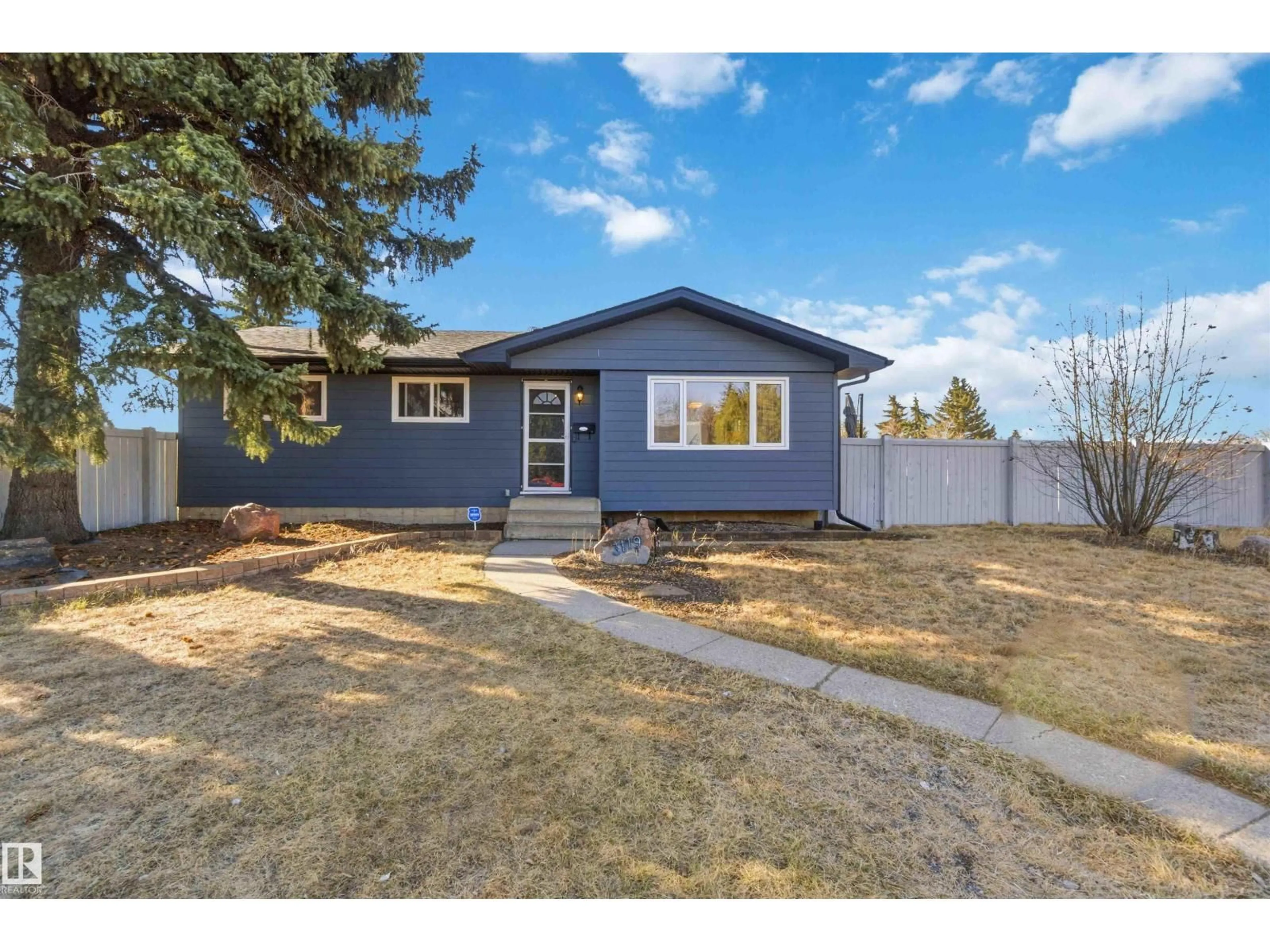 Home with vinyl exterior material, street for 3119 110 AV, Edmonton Alberta T5W0H2
