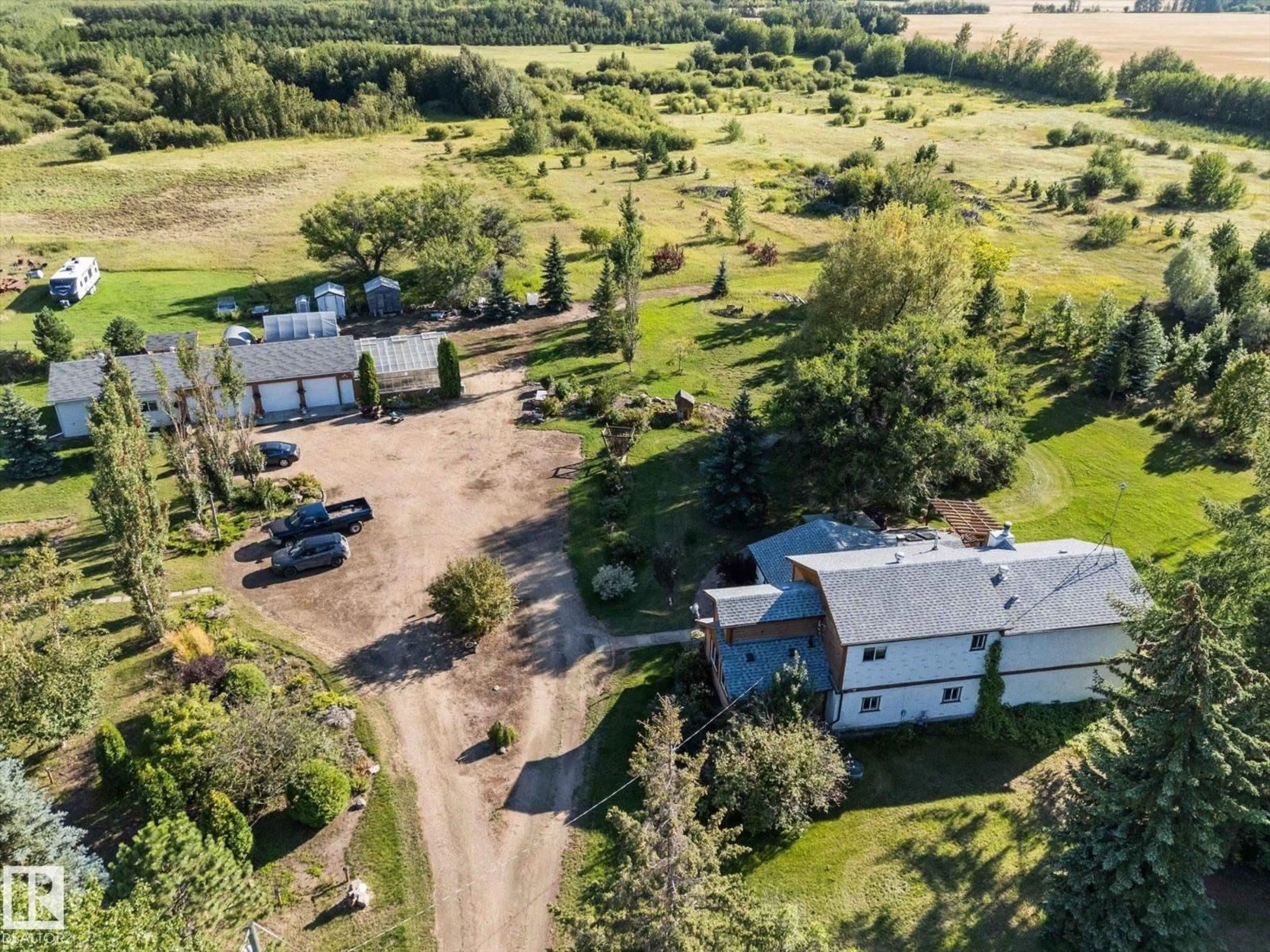 A pic from outside/outdoor area/front of a property/back of a property/a pic from drone, unknown for 22427 HIGHWAY 28, Rural Sturgeon County Alberta T0A0K4