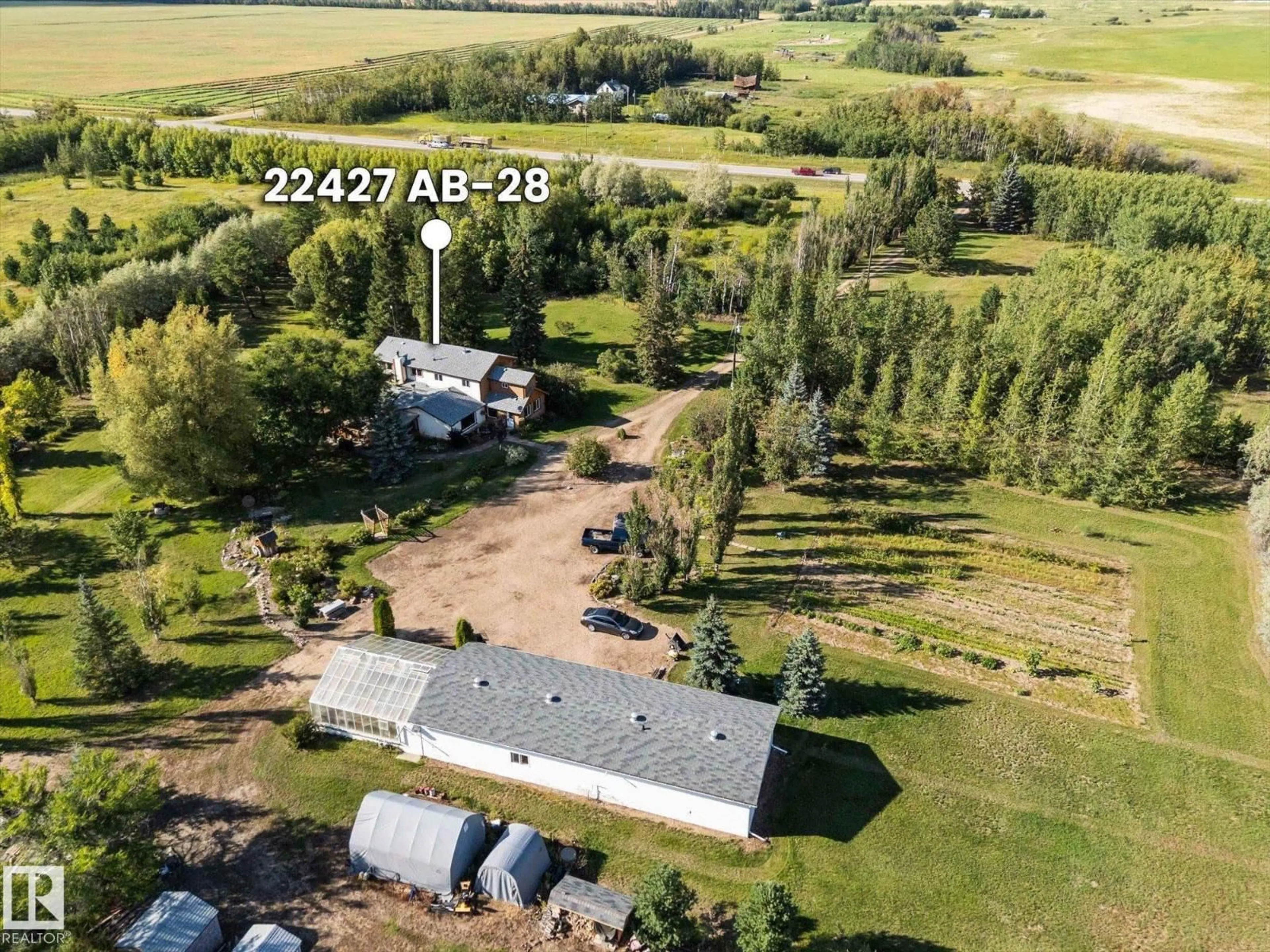 A pic from outside/outdoor area/front of a property/back of a property/a pic from drone, unknown for 22427 HIGHWAY 28, Rural Sturgeon County Alberta T0A0K4