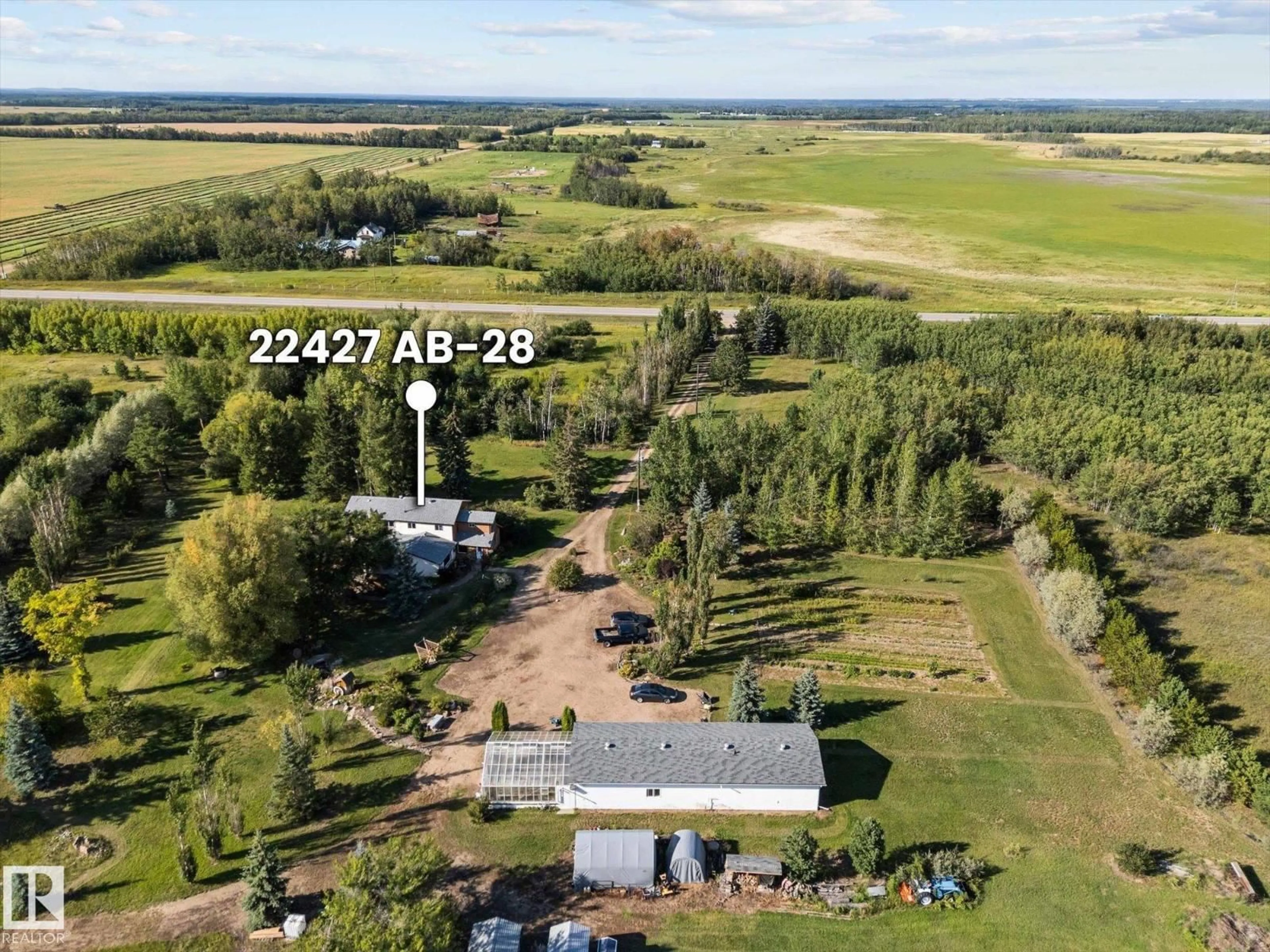 A pic from outside/outdoor area/front of a property/back of a property/a pic from drone, building for 22427 HIGHWAY 28, Rural Sturgeon County Alberta T0A0K4