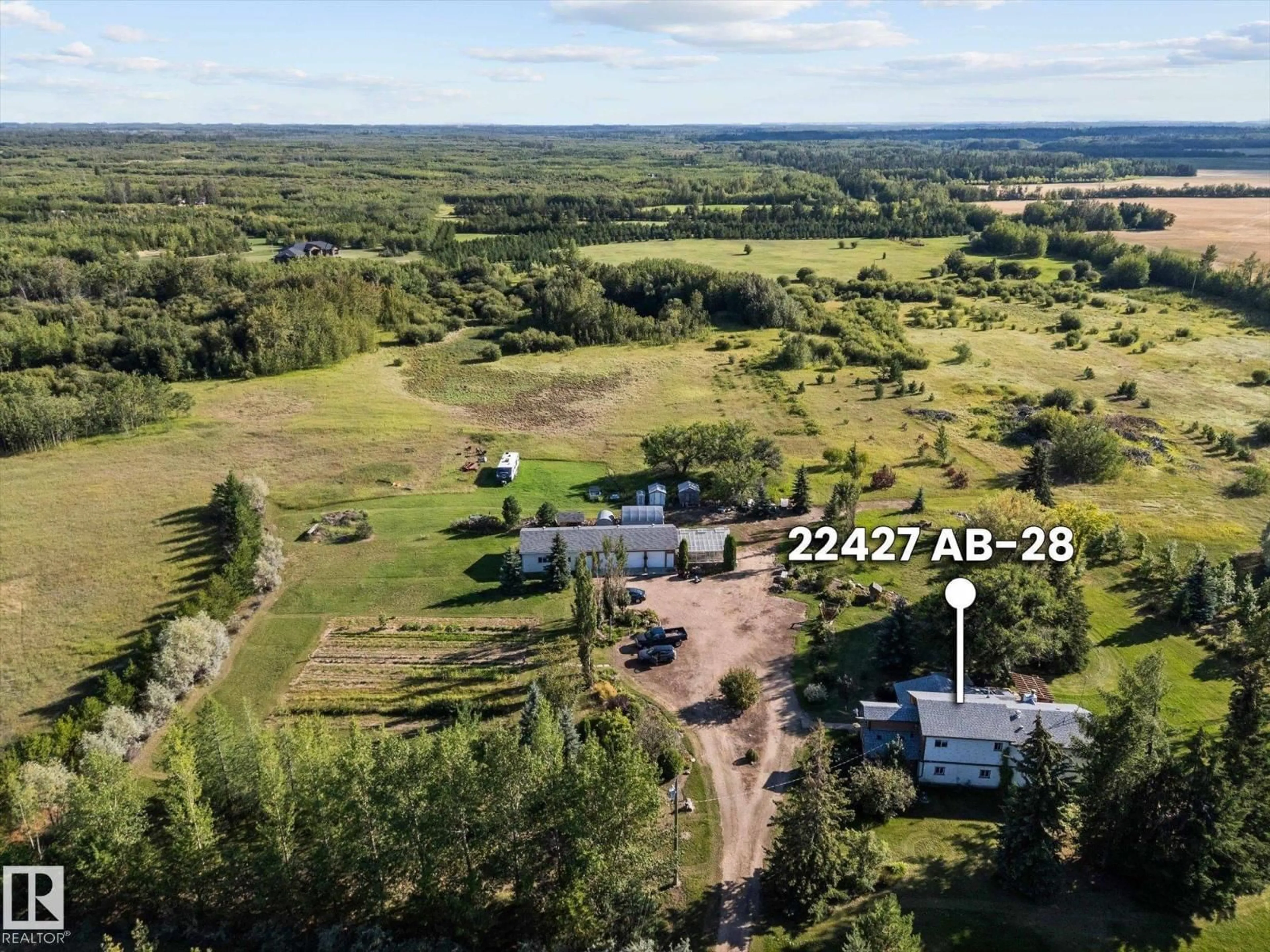 A pic from outside/outdoor area/front of a property/back of a property/a pic from drone, unknown for 22427 HIGHWAY 28, Rural Sturgeon County Alberta T0A0K4