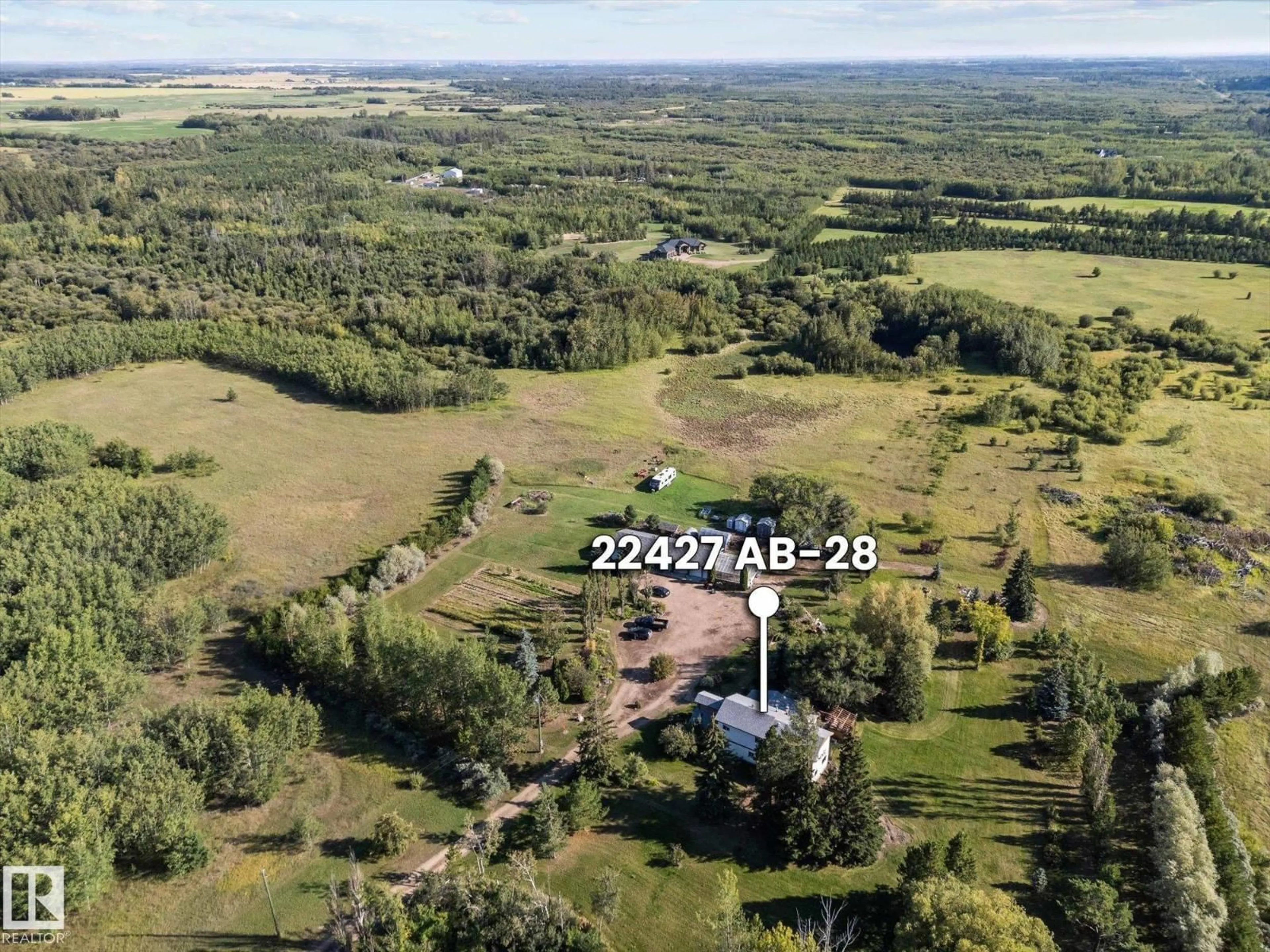 A pic from outside/outdoor area/front of a property/back of a property/a pic from drone, unknown for 22427 HIGHWAY 28, Rural Sturgeon County Alberta T0A0K4