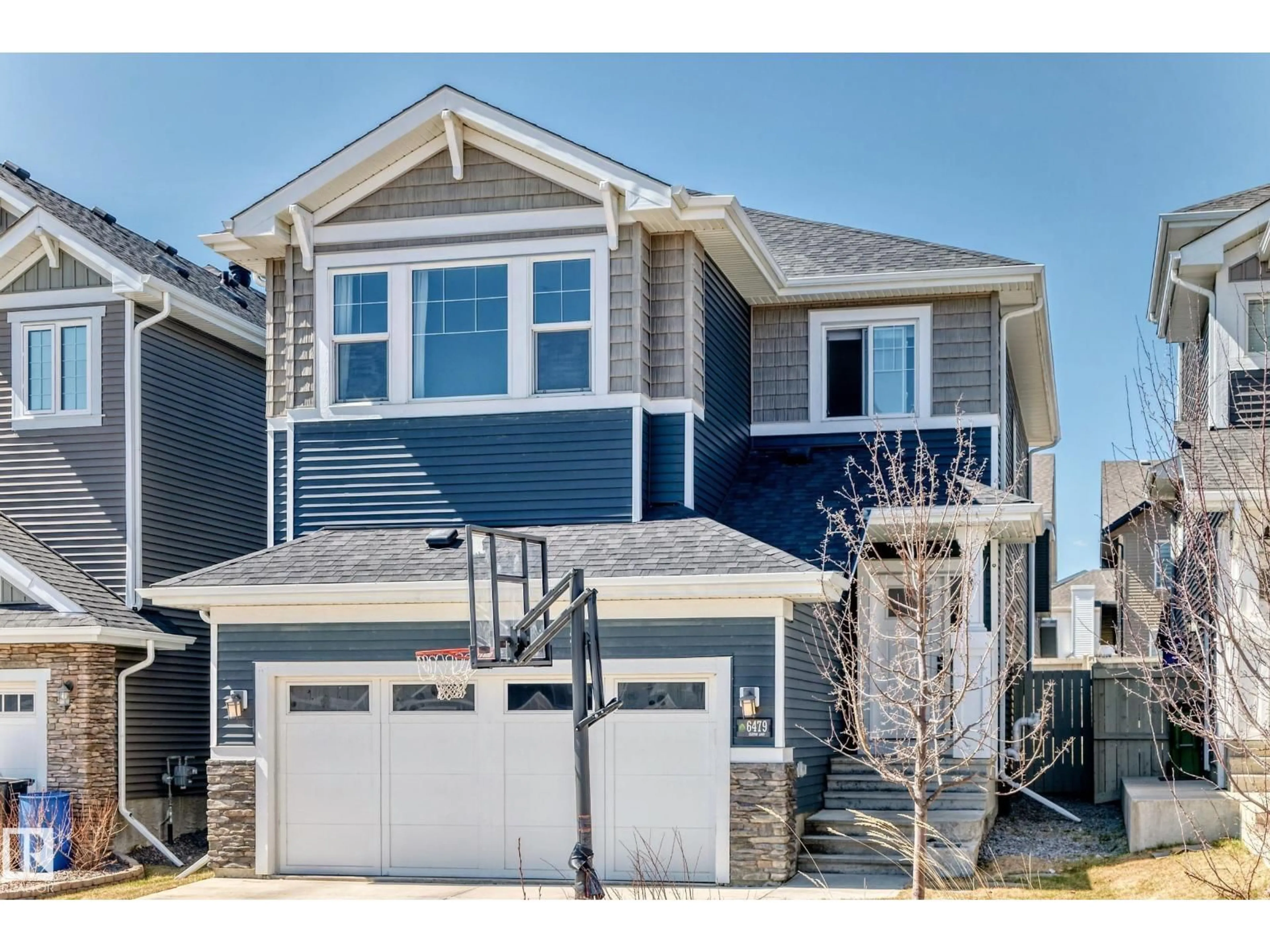 Home with vinyl exterior material, street for 6479 ELSTON LO, Edmonton Alberta T6M0V9