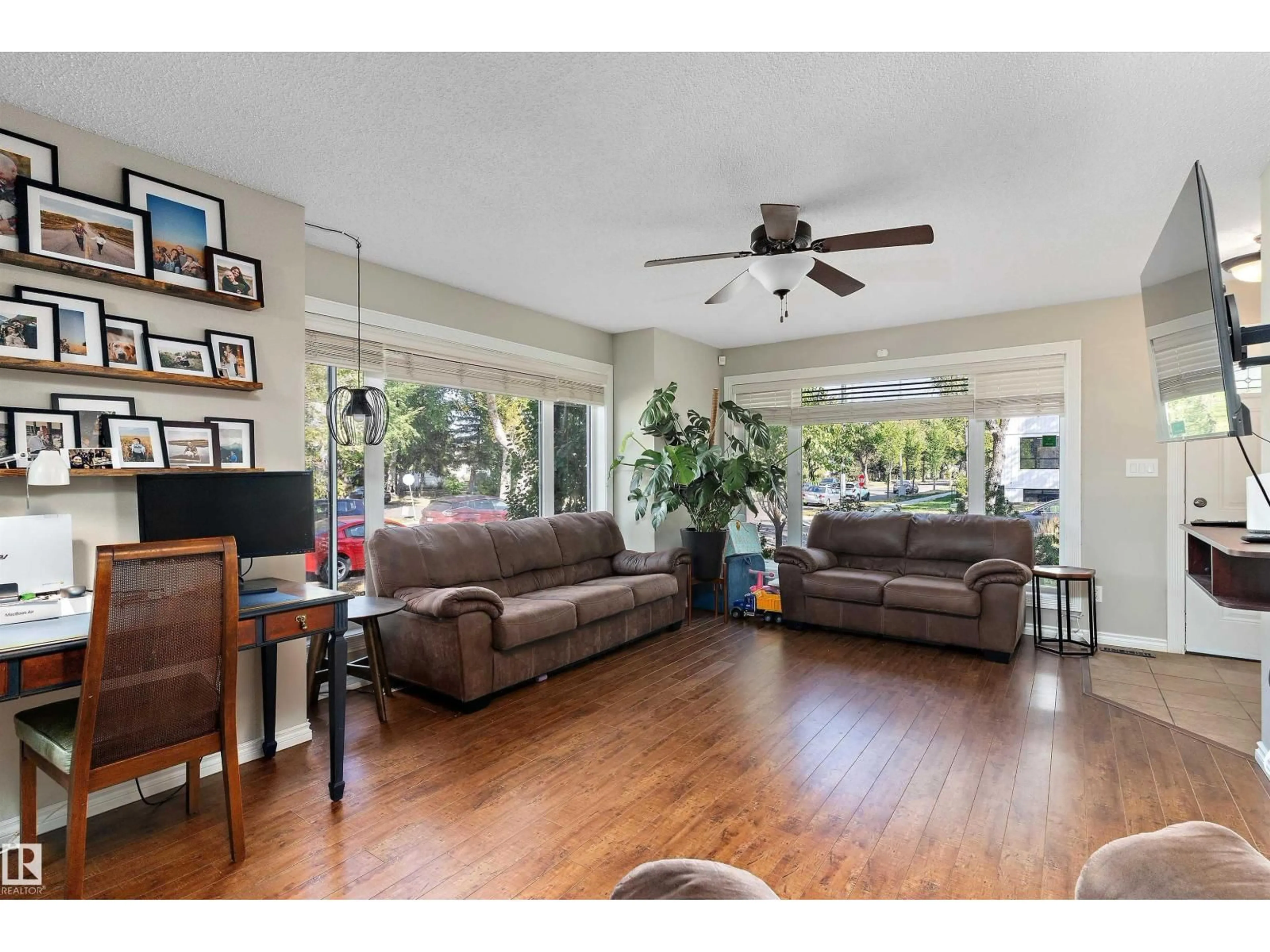 Living room with furniture, wood/laminate floor for 11846 125 ST, Edmonton Alberta T5L0R9