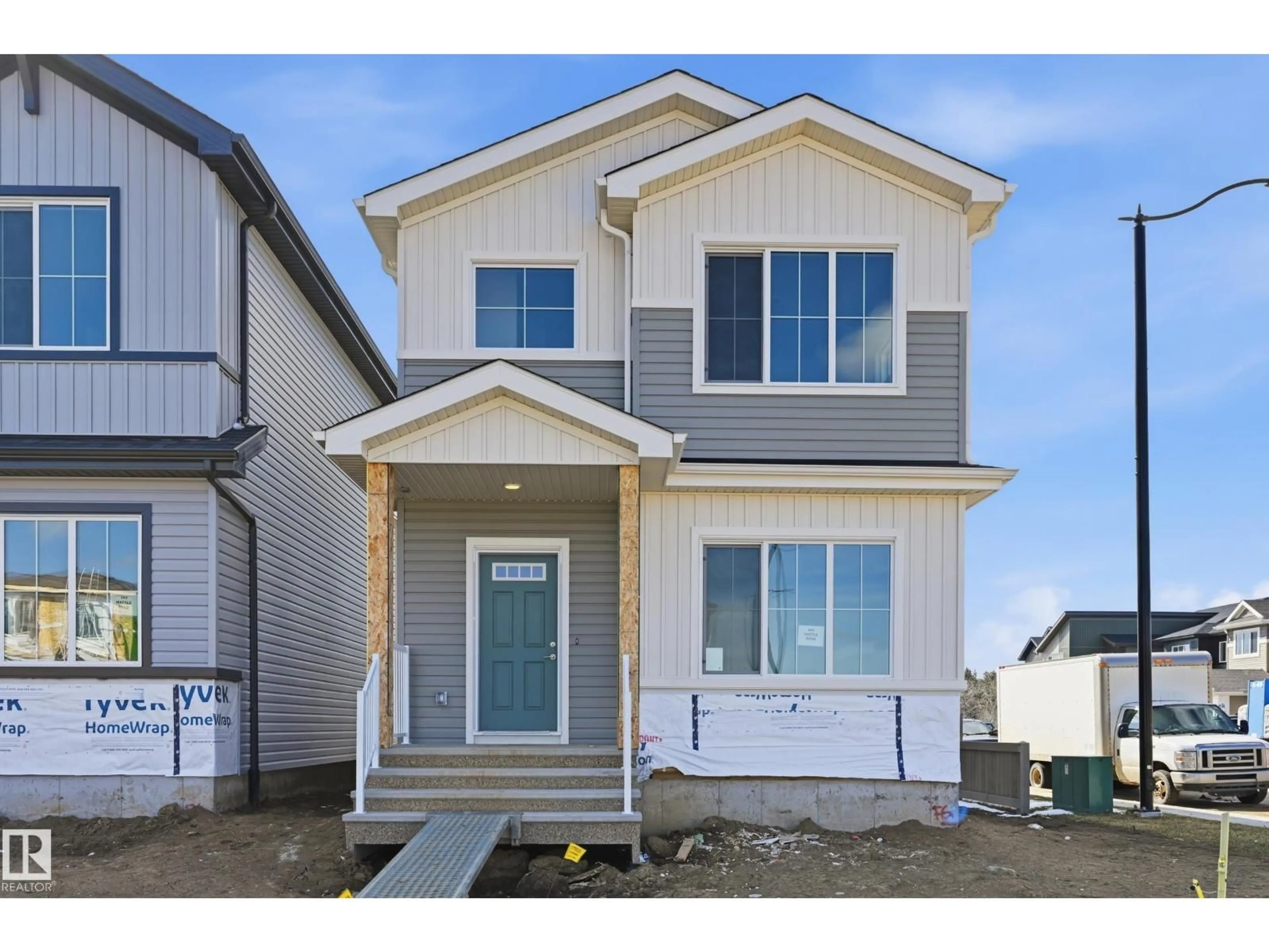 Home with vinyl exterior material, street for 245 WATTLE RD, Leduc Alberta T9E0T7