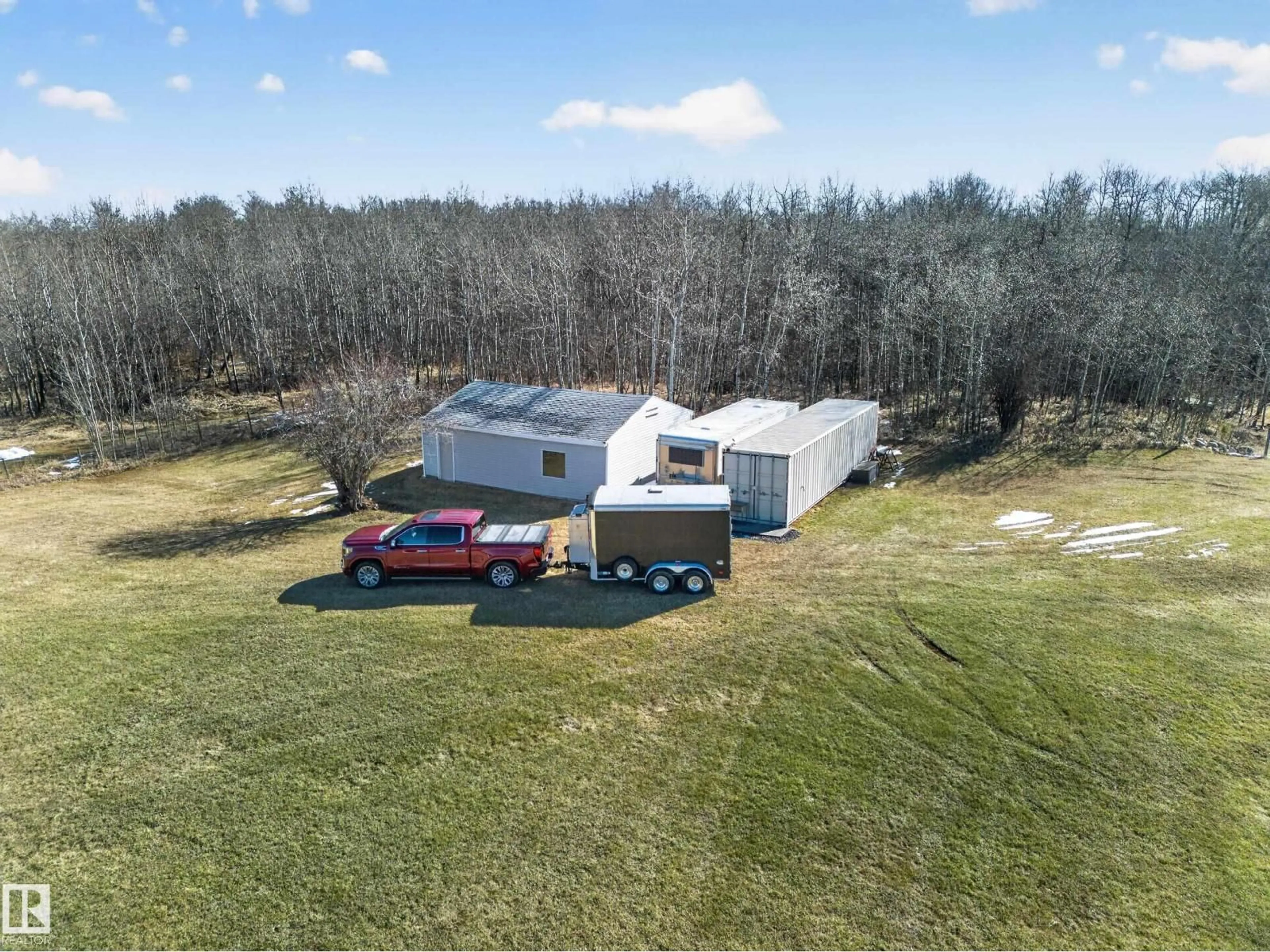 A pic from outside/outdoor area/front of a property/back of a property/a pic from drone, building for 301 - 52471 RGE ROAD 223, Rural Strathcona County Alberta T8A4P9