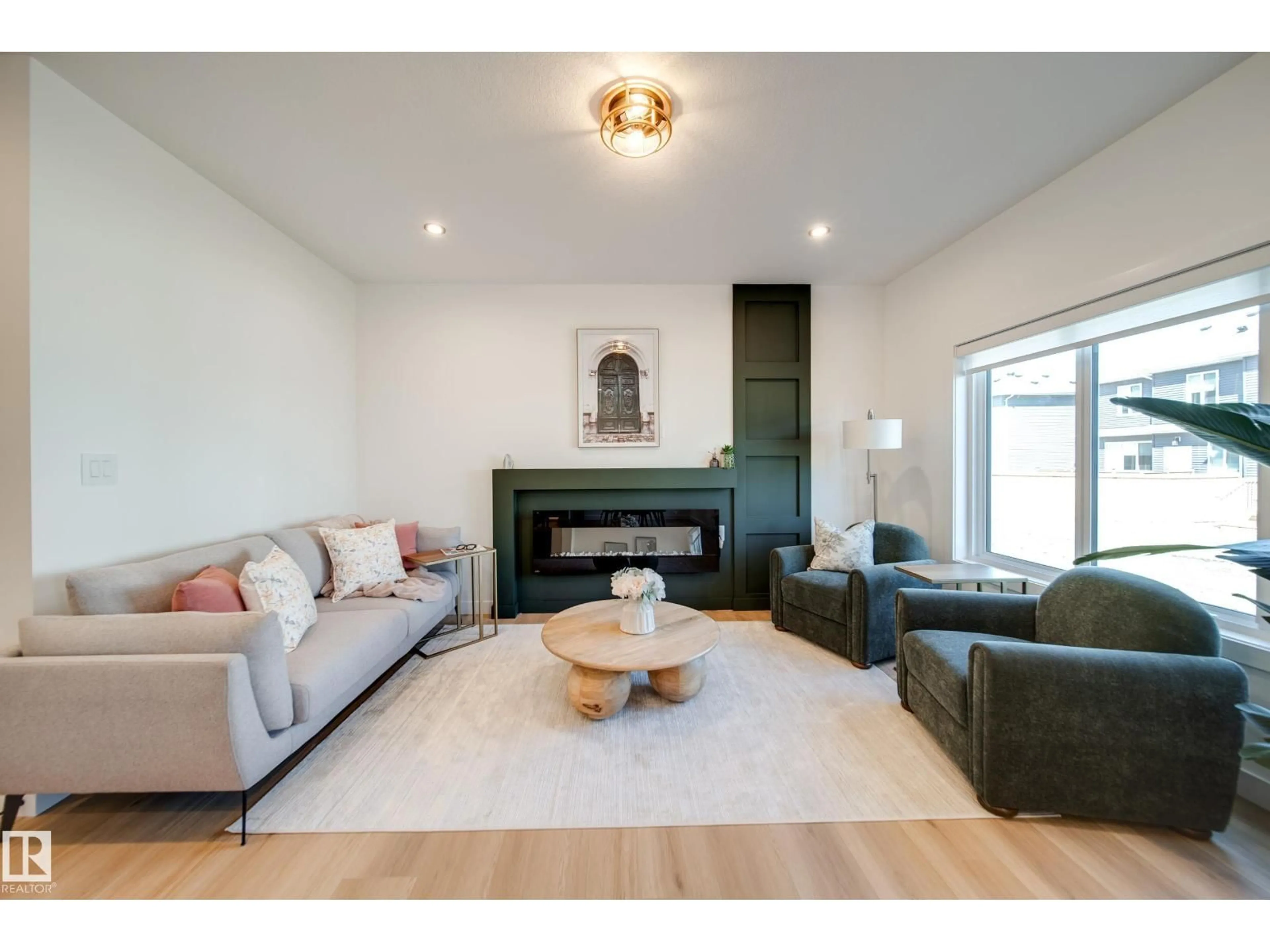 Living room with furniture, wood/laminate floor for 16 BLACKBIRD BN, Fort Saskatchewan Alberta T8L0G6
