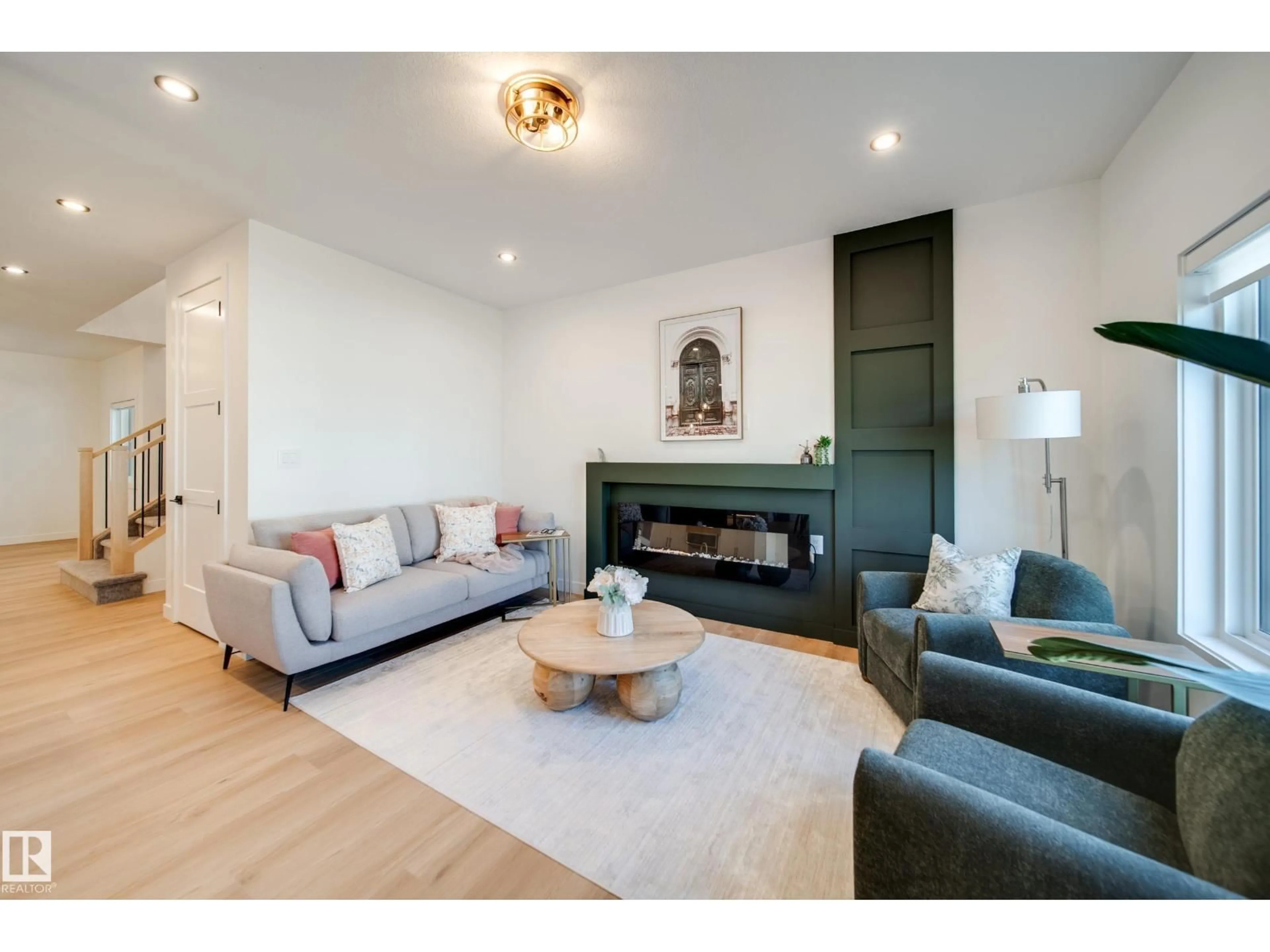 Living room with furniture, wood/laminate floor for 16 BLACKBIRD BN, Fort Saskatchewan Alberta T8L0G6