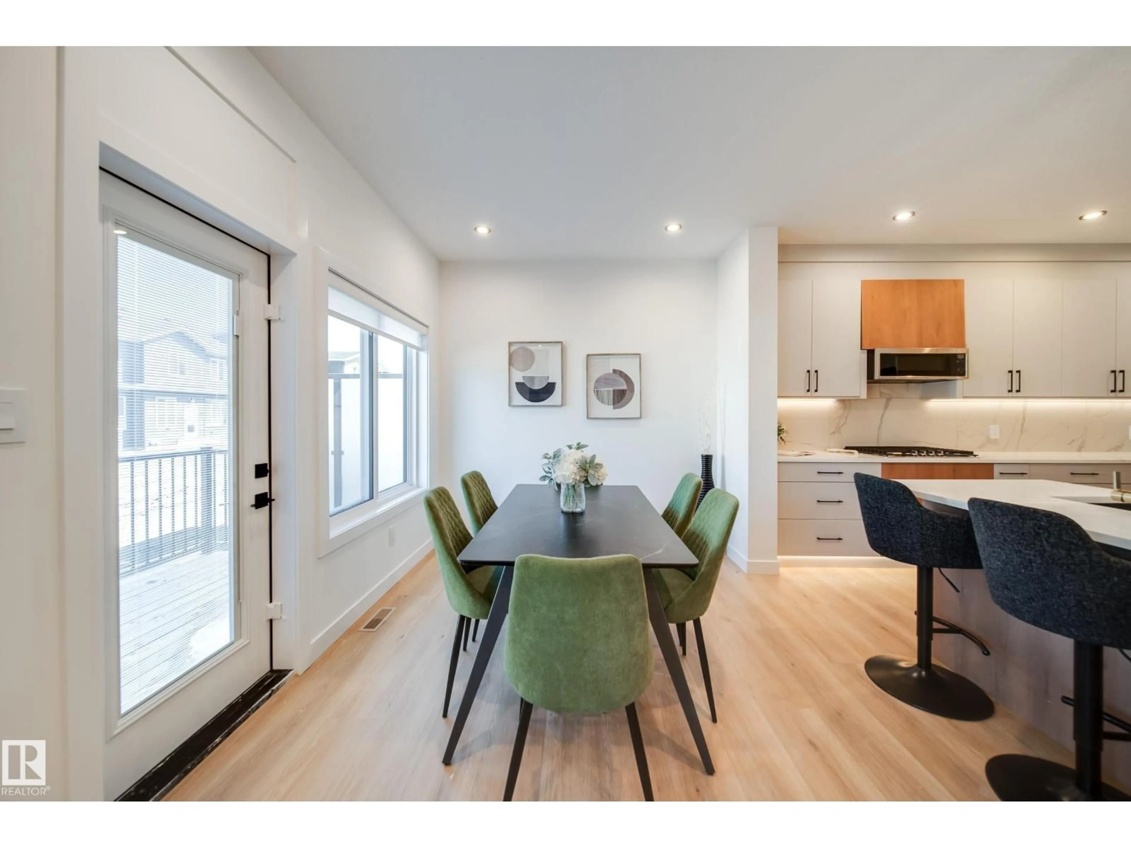 Dining room, wood/laminate floor for 16 BLACKBIRD BN, Fort Saskatchewan Alberta T8L0G6