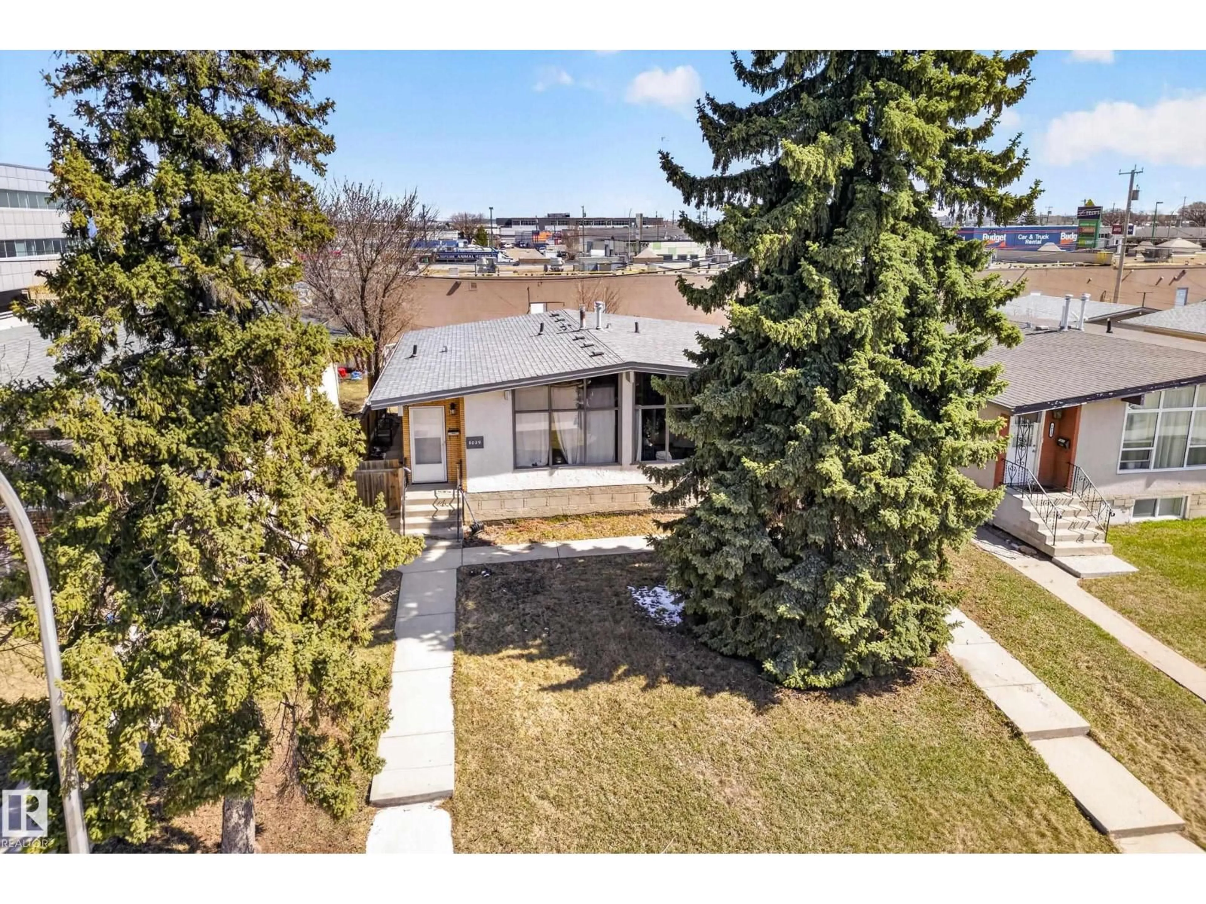 A pic from outside/outdoor area/front of a property/back of a property/a pic from drone, street for 6027 6029 105 ST NW, Edmonton Alberta T6H2N3
