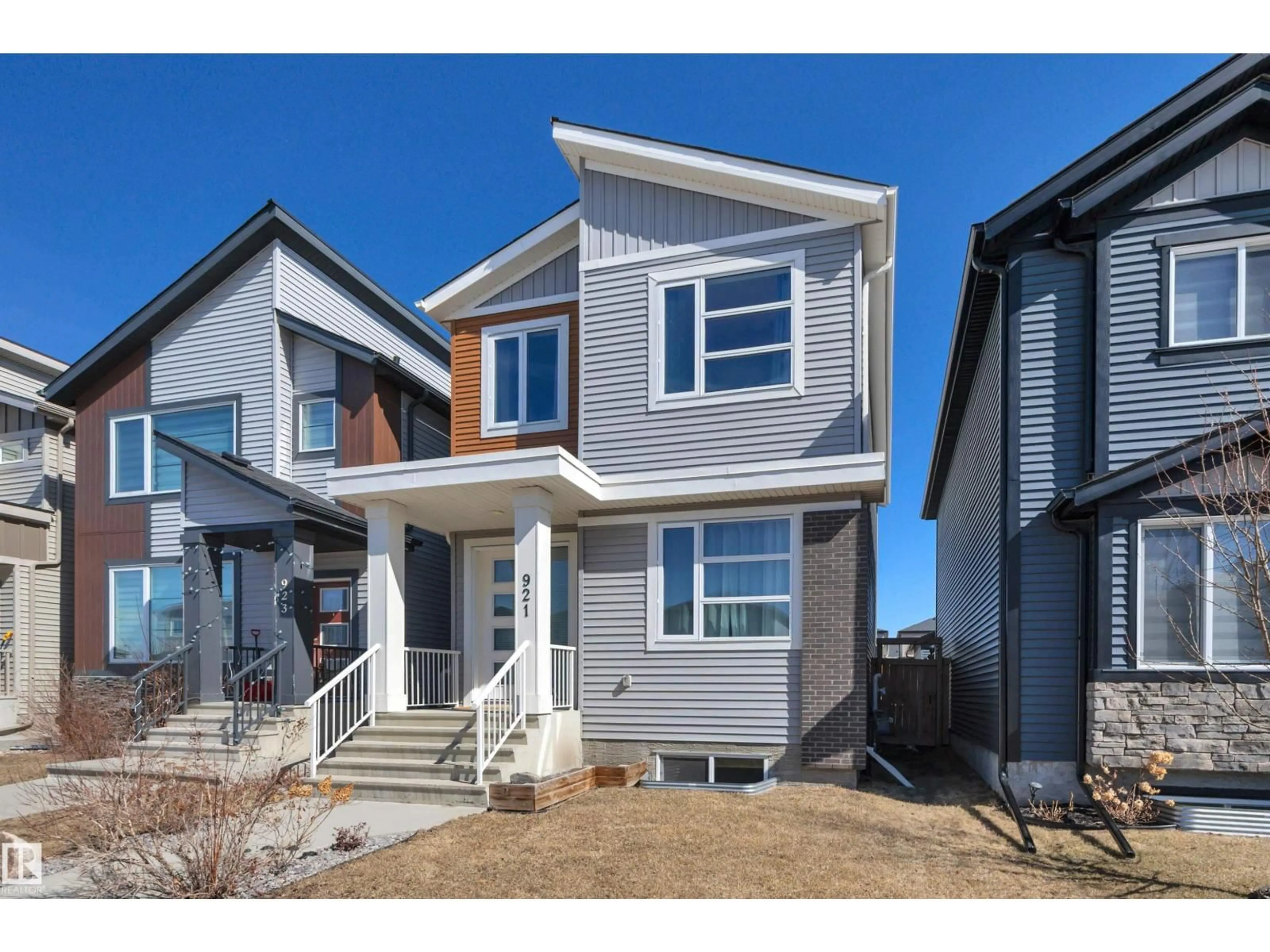 Home with vinyl exterior material, street for 921 BERG PL, Leduc Alberta T9E1J6